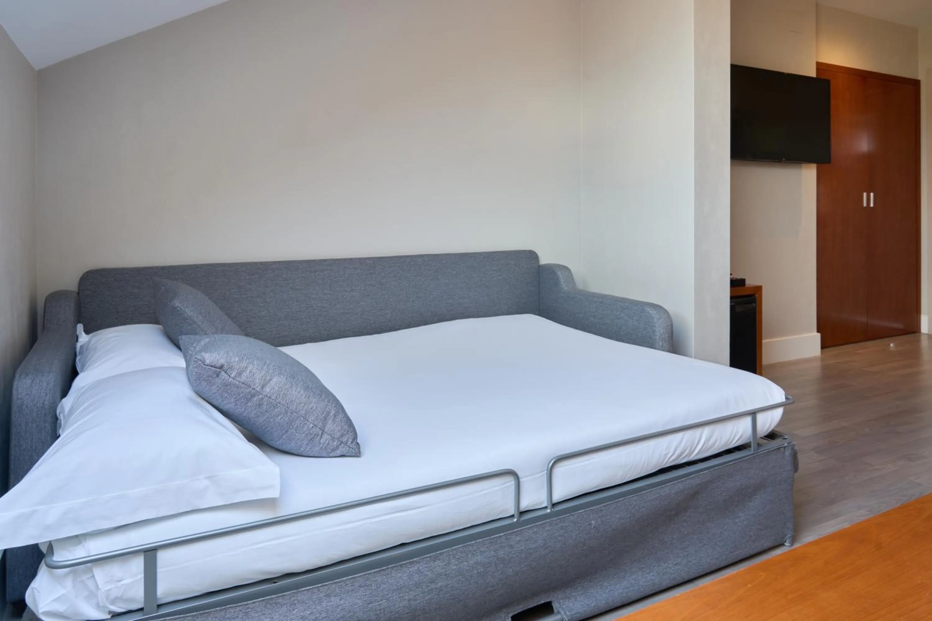 Bed in Hotel Puerta de Toledo