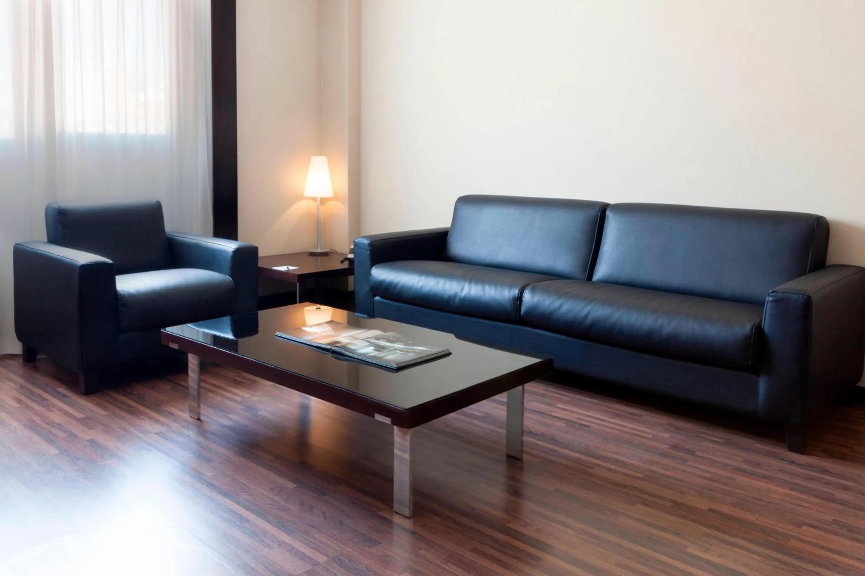 Living room in AC Hotel Elda by Marriott