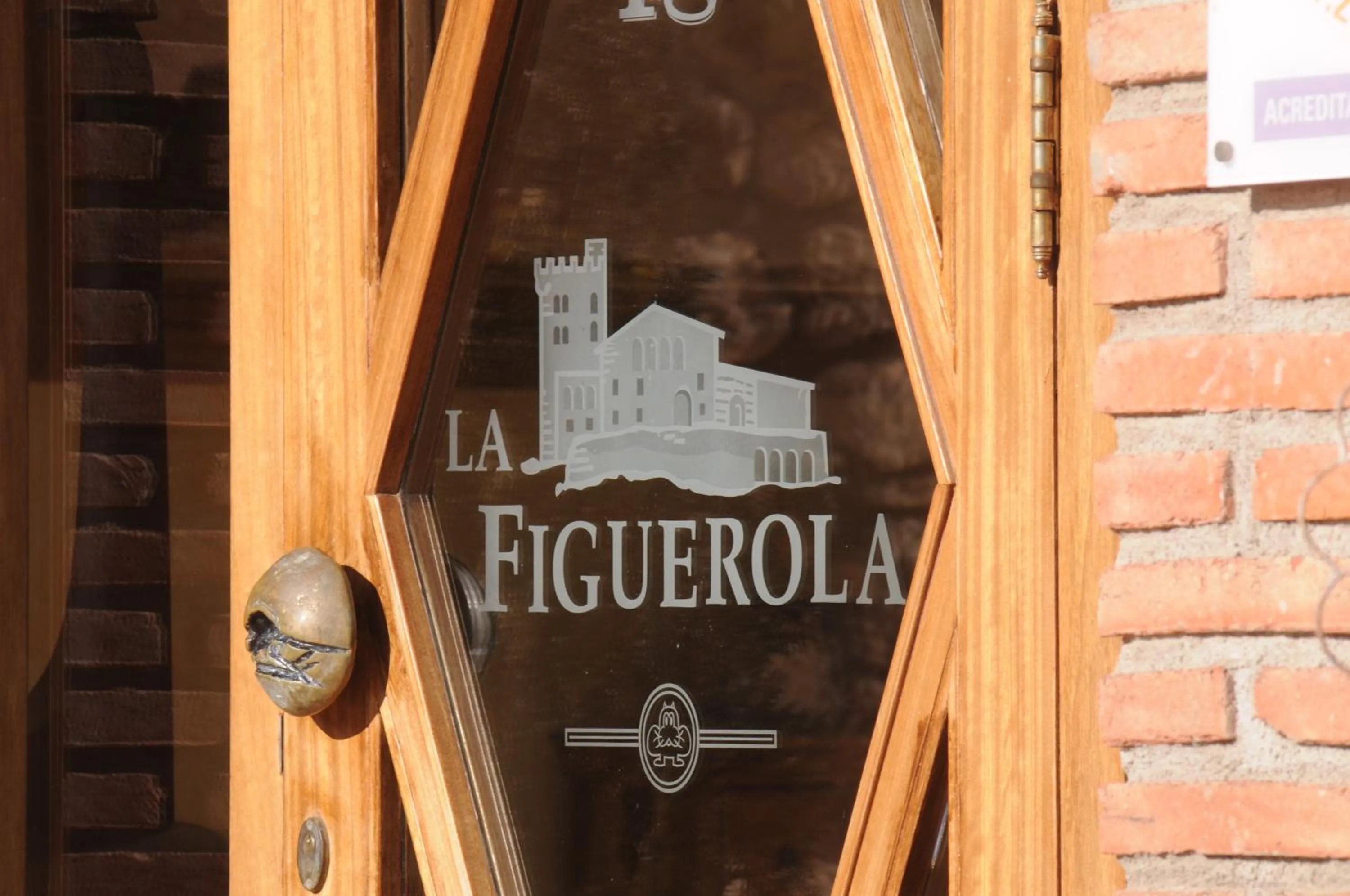 Property logo or sign in La Figuerola Hotel & Restaurant