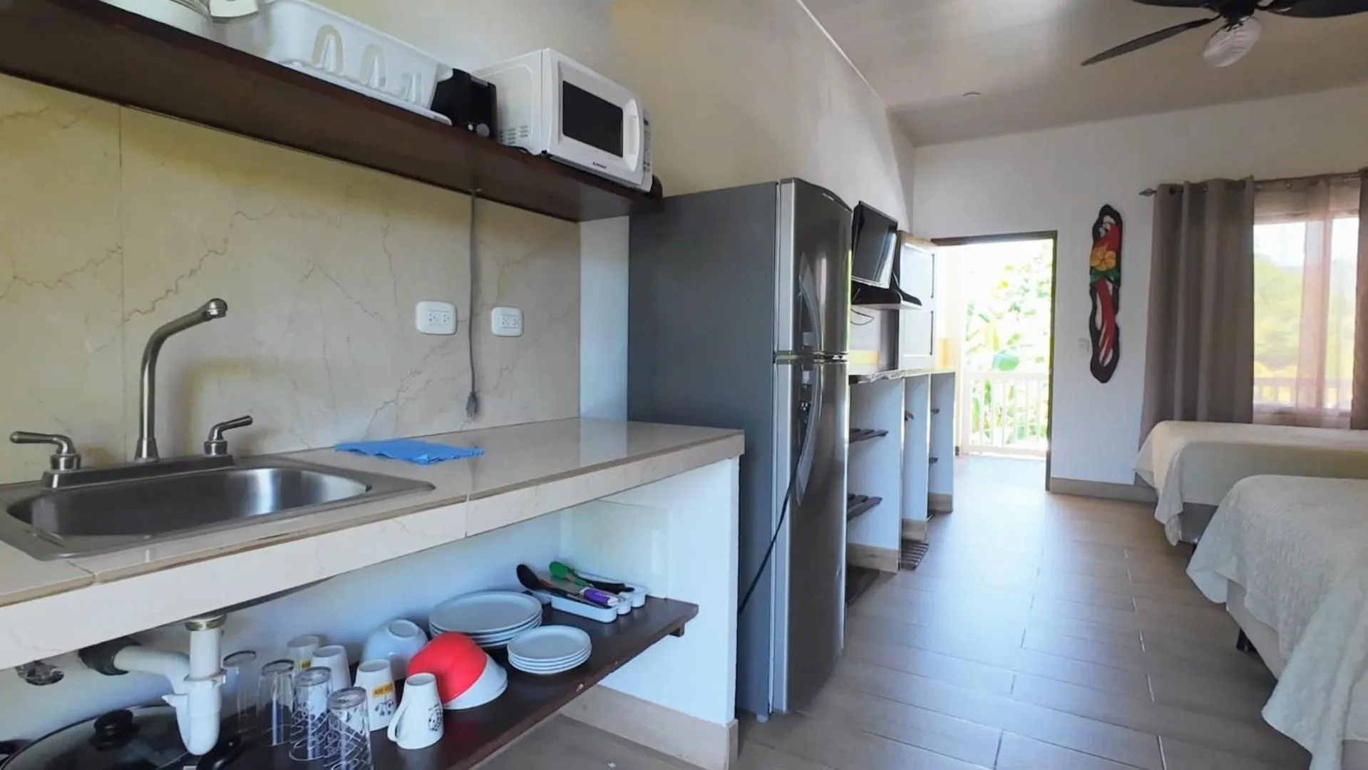 Kitchen or kitchenette, Bed in Cabinas El Colibri, Apart Hotel
