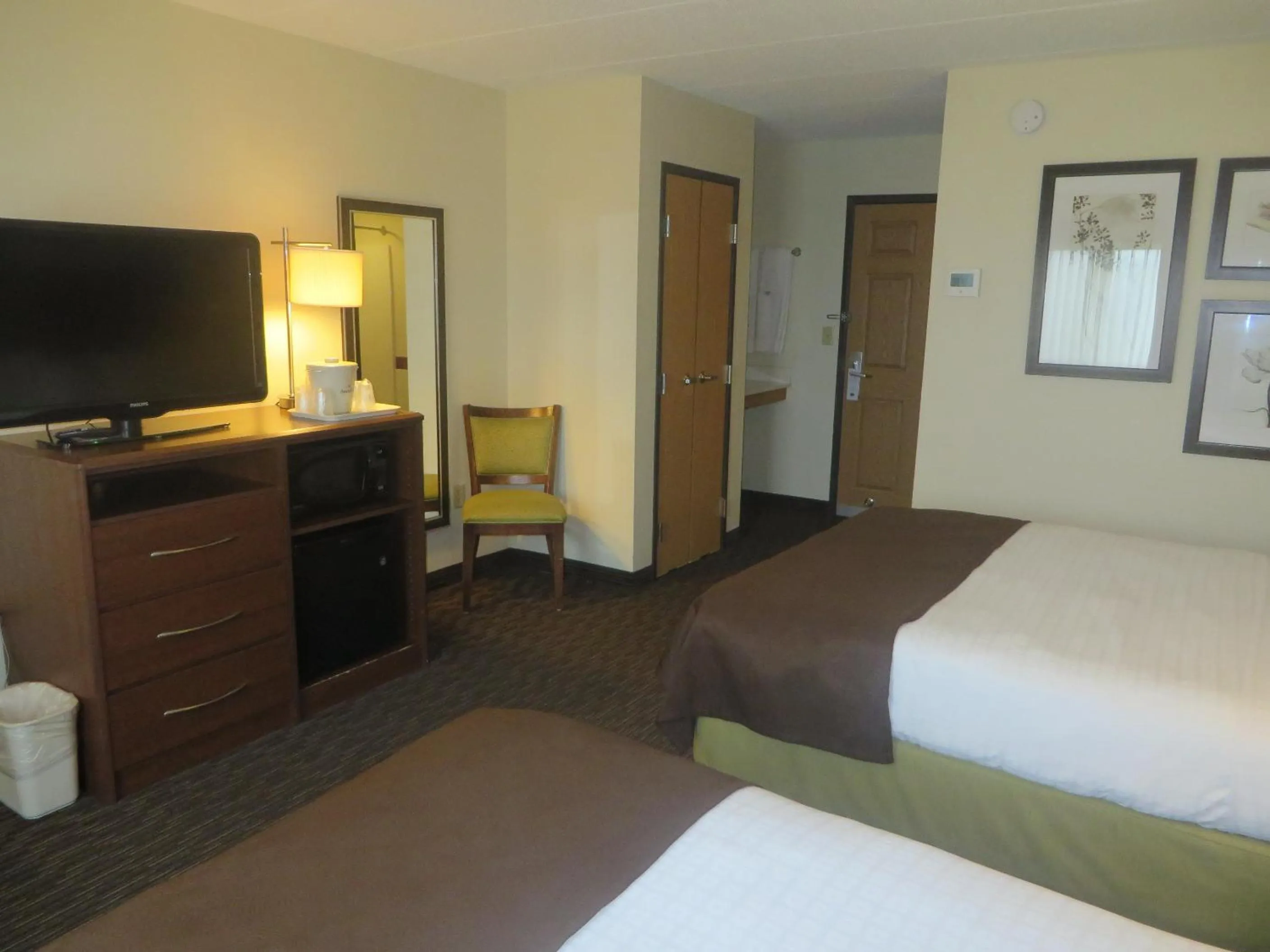 Bed in AmericInn by Wyndham Rice Lake