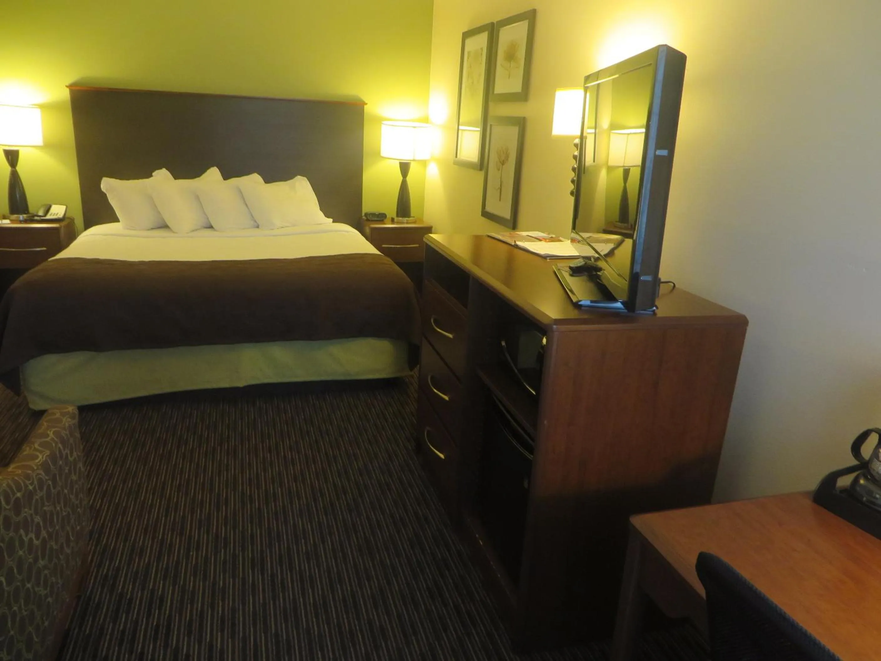 Bed in AmericInn by Wyndham Rice Lake