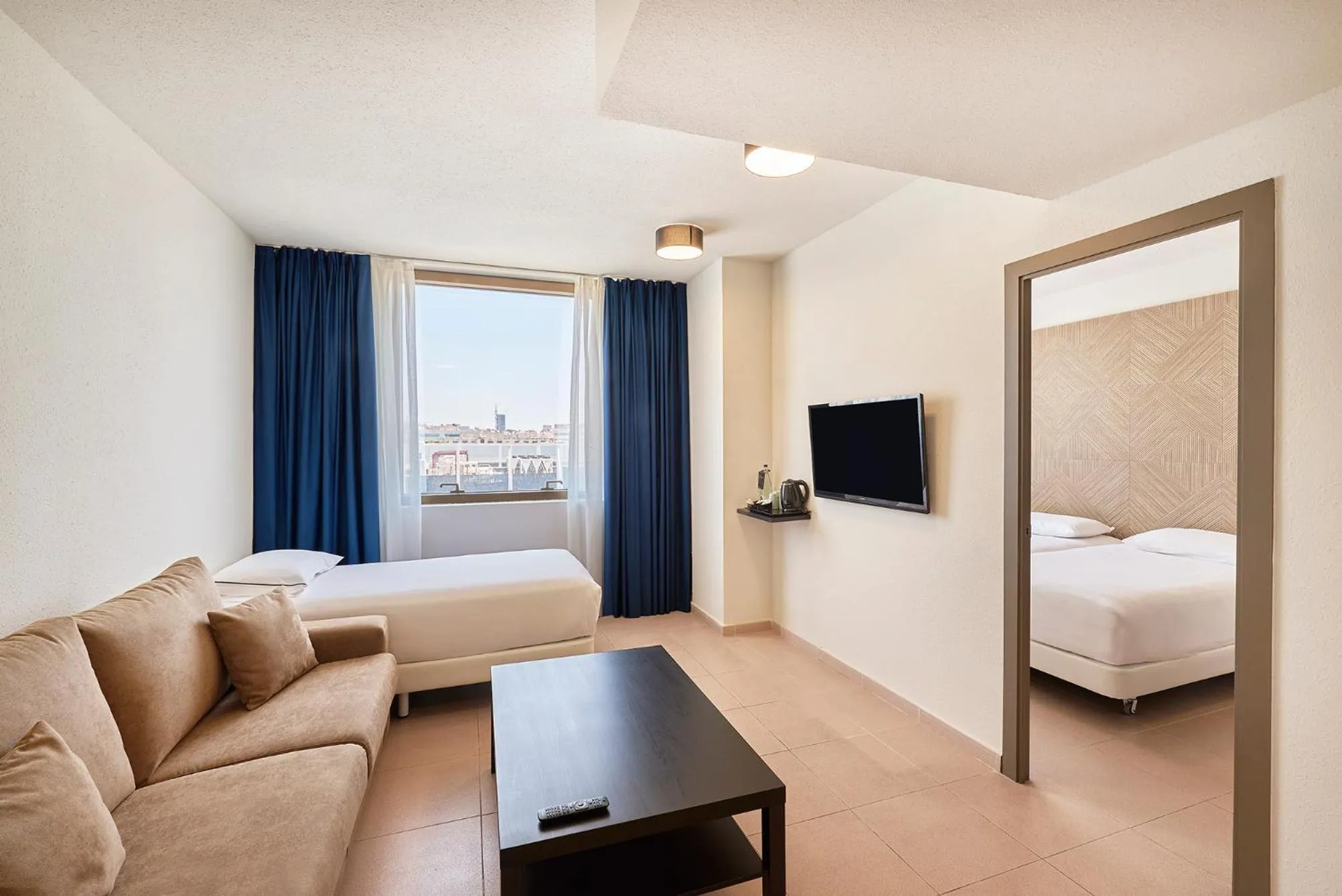 Living room, Bed in Hesperia Sant Joan