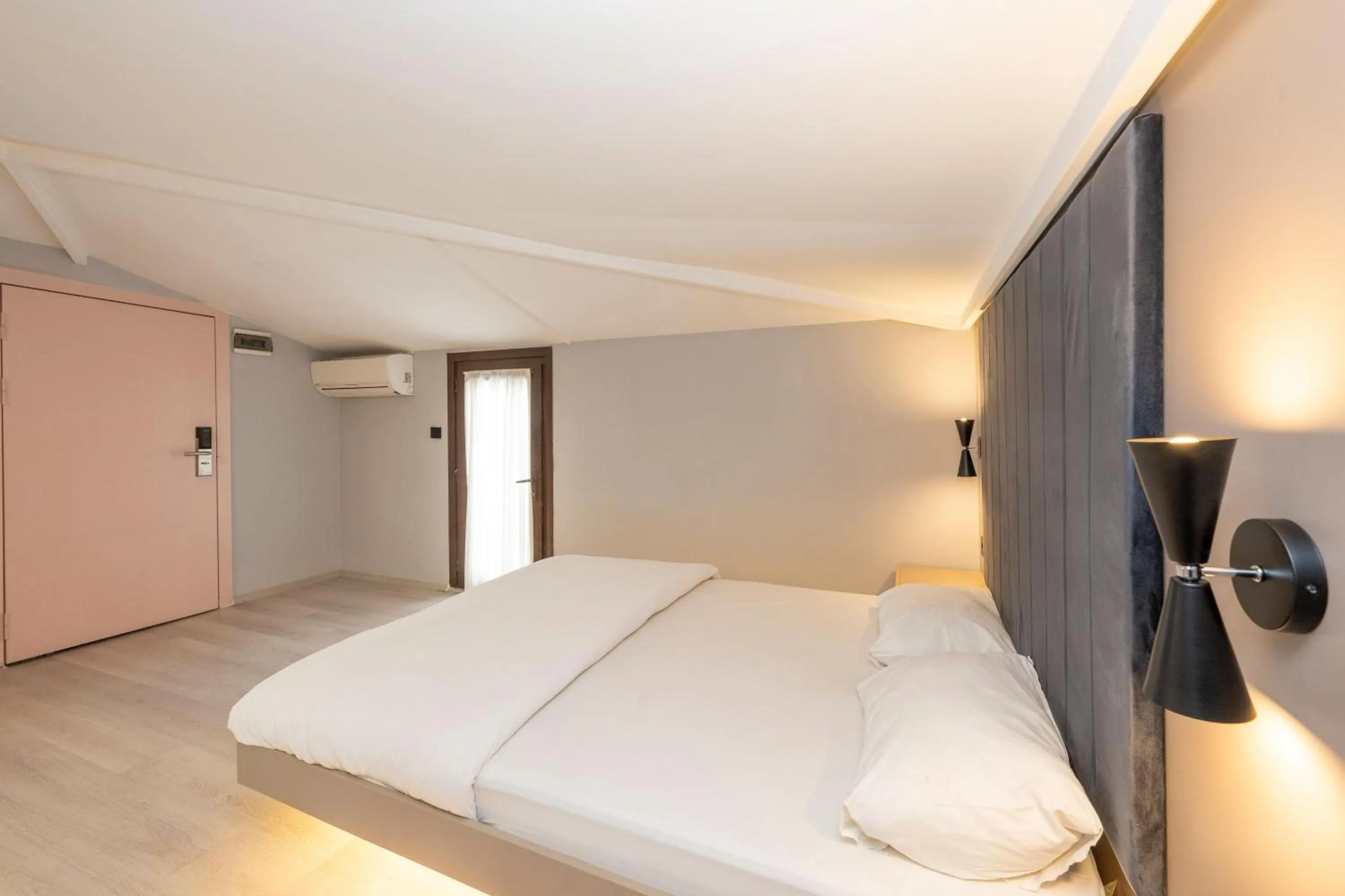 Bed in Cirrus Suites