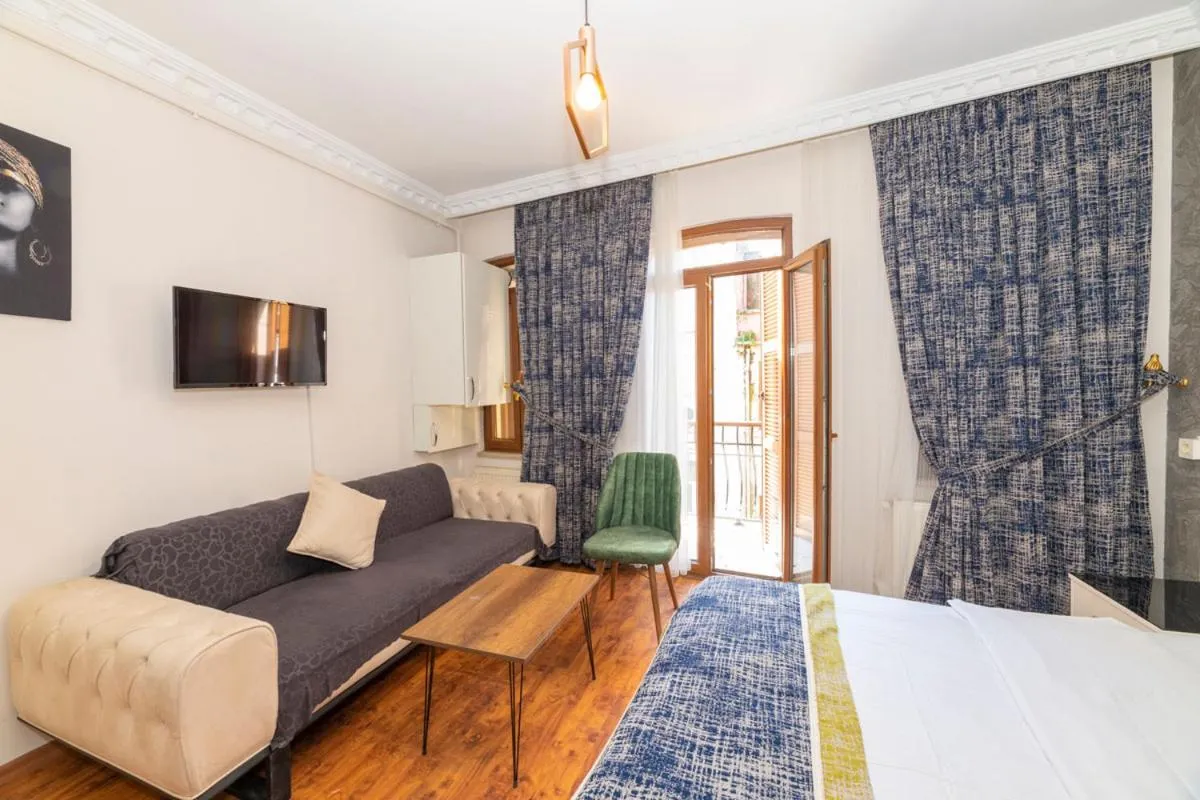 Seating area, Bed in GRAND OPERA HOTEL