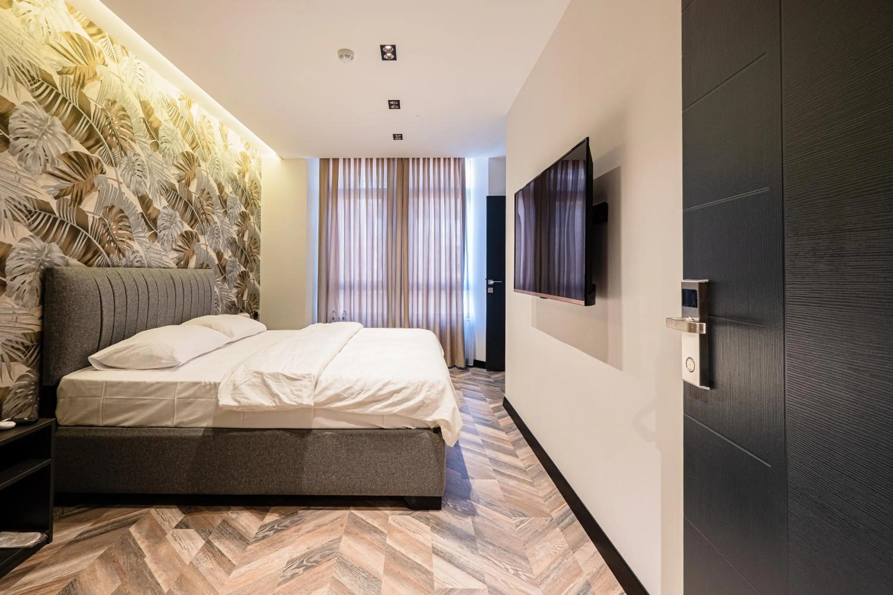 Bed in Angelo Coffee Suites