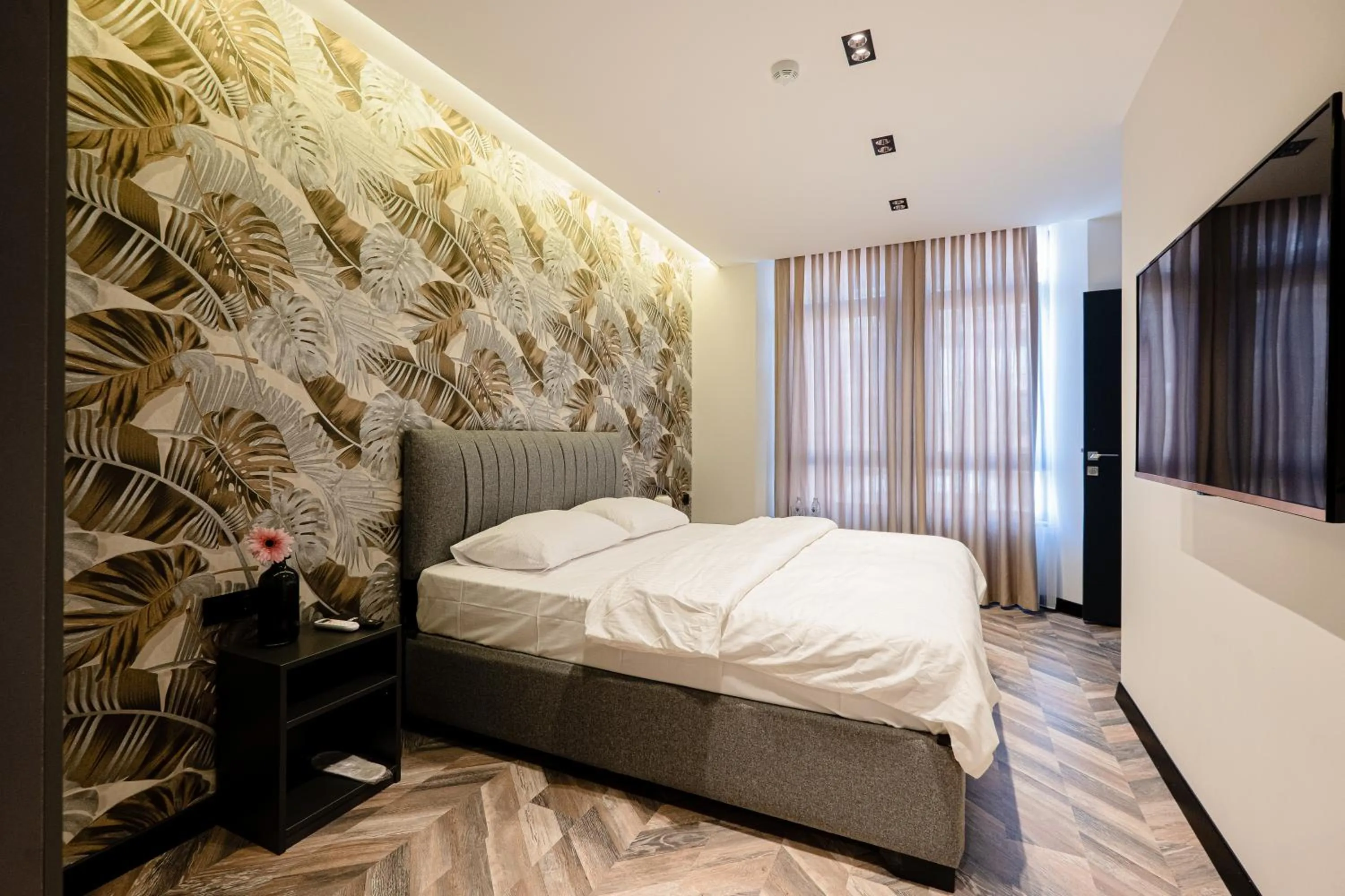 Bed in Angelo Coffee Suites