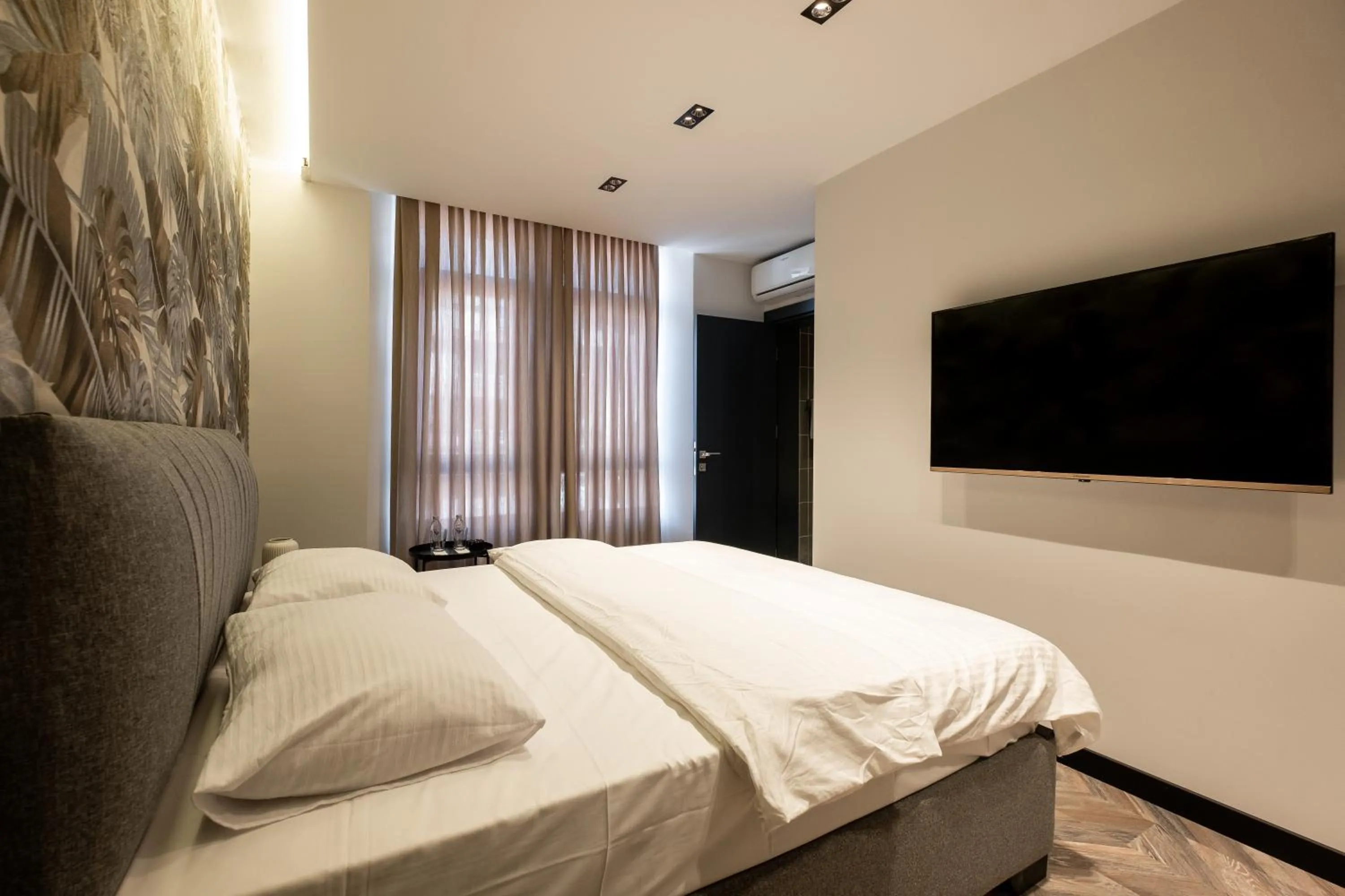 Bed in Angelo Coffee Suites