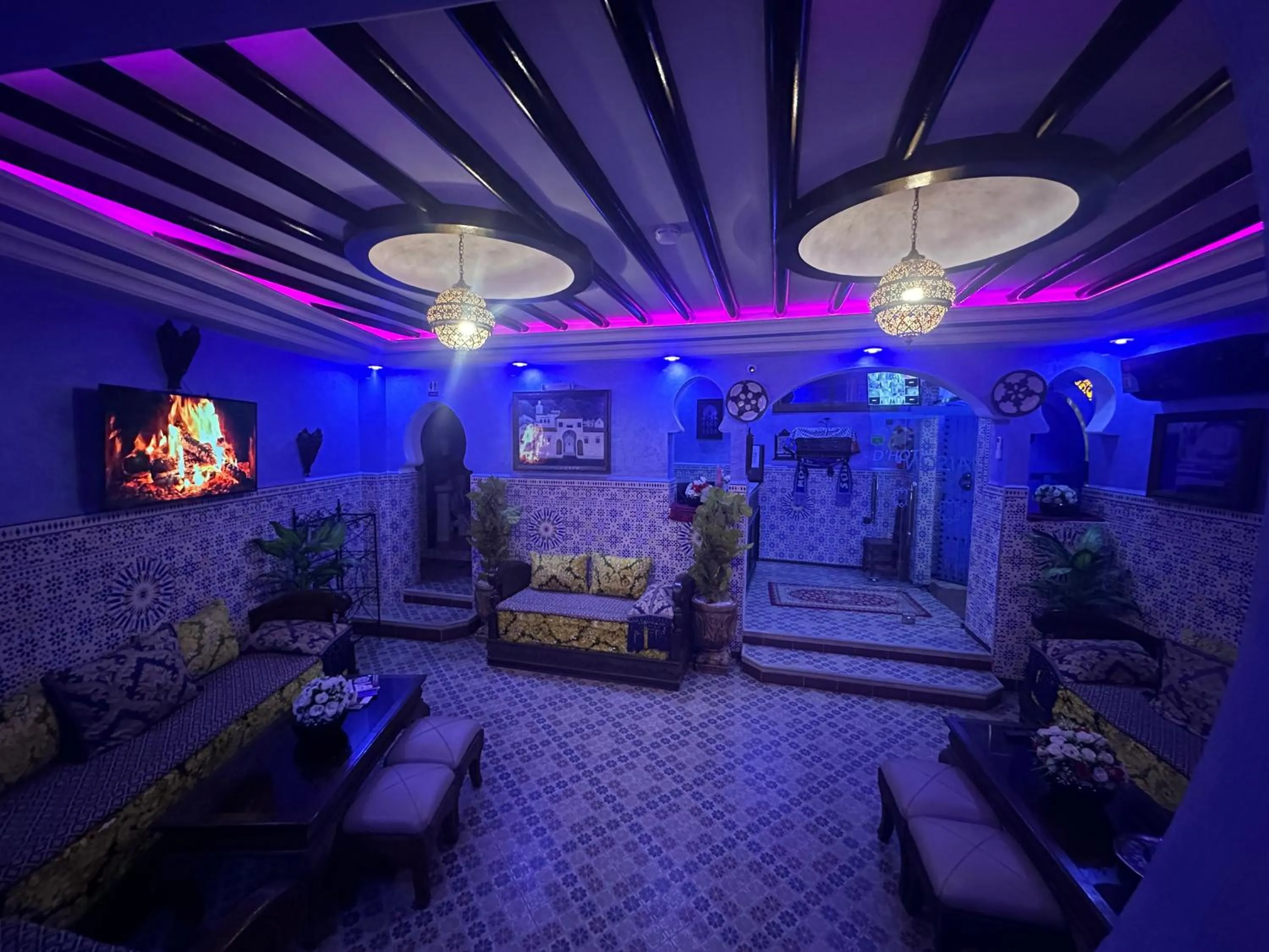 Communal lounge/ TV room in Maison d'hôtes Afassi