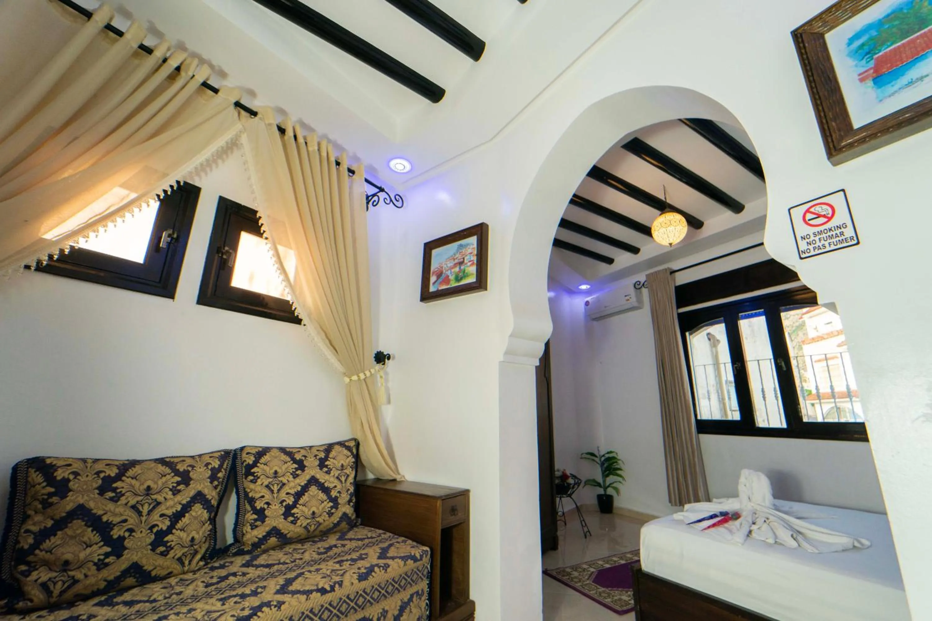 Bed in Maison d'hôtes Afassi