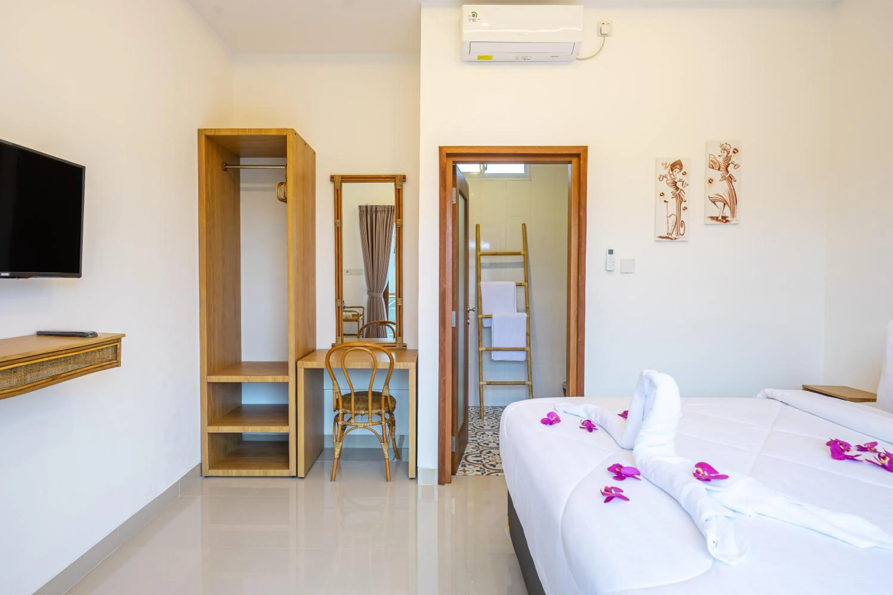 Bed in Kasmaran Bali Guest House