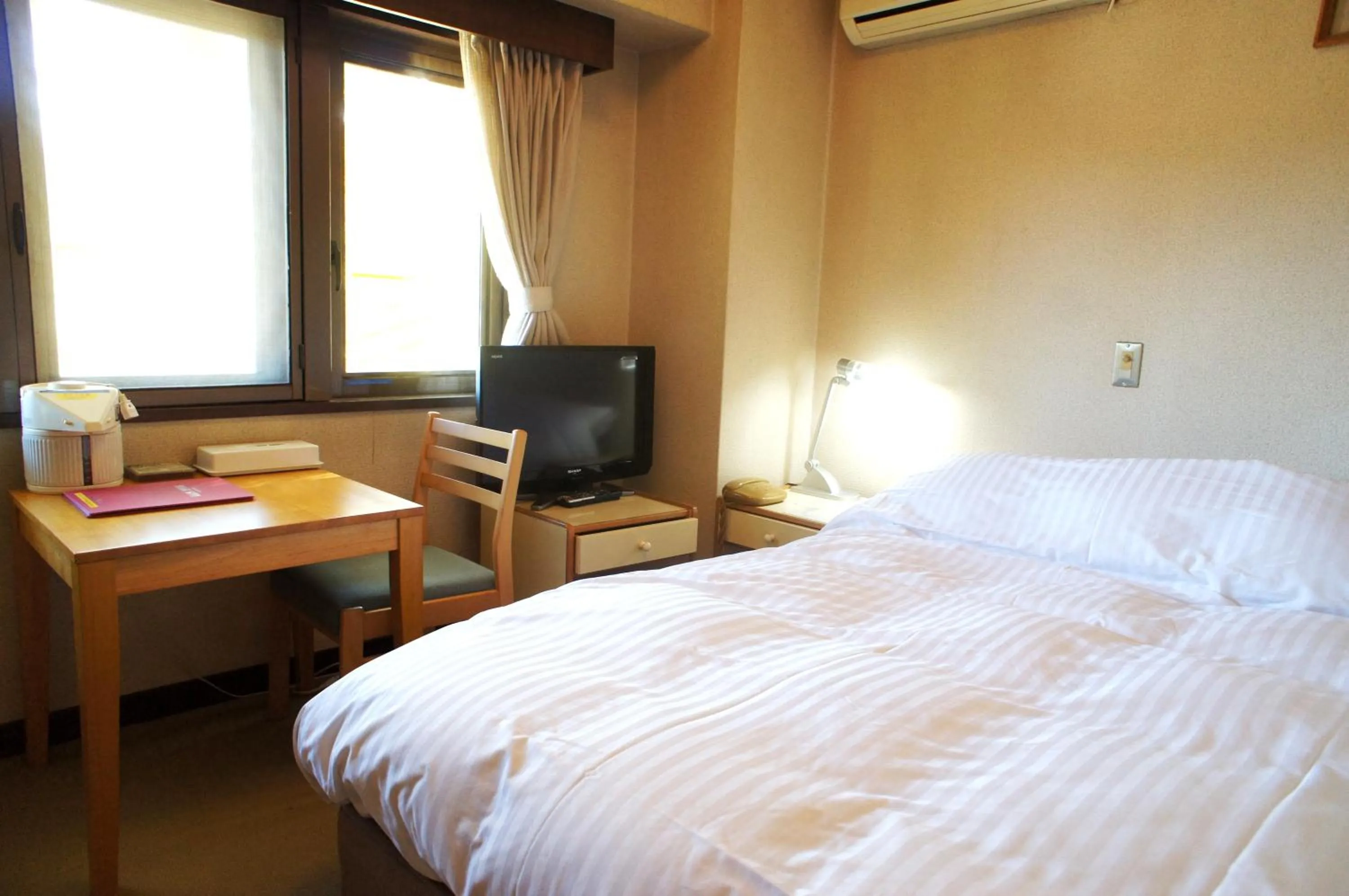 Bed in Petit Hotel Shitaka