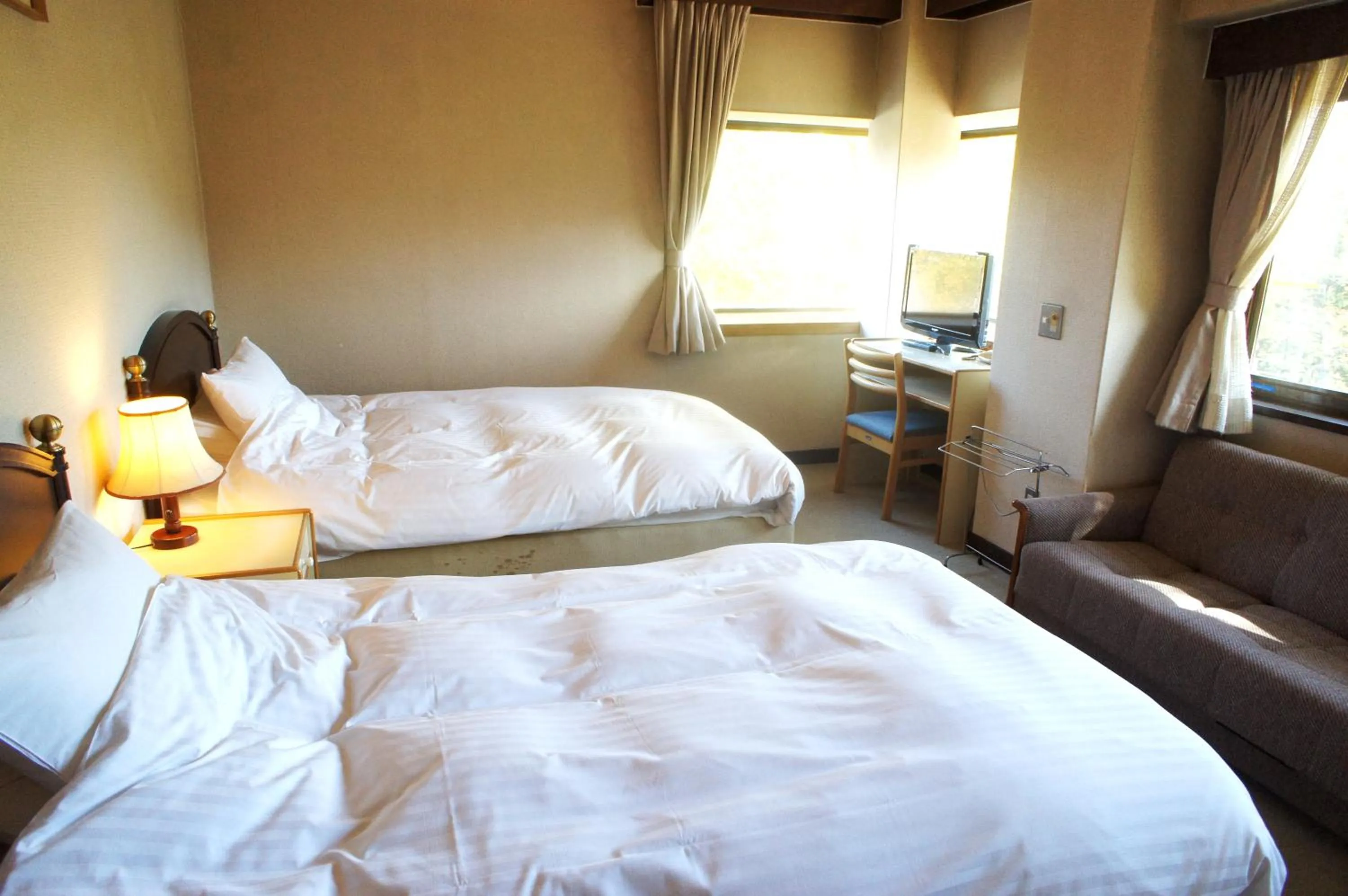 Bed in Petit Hotel Shitaka