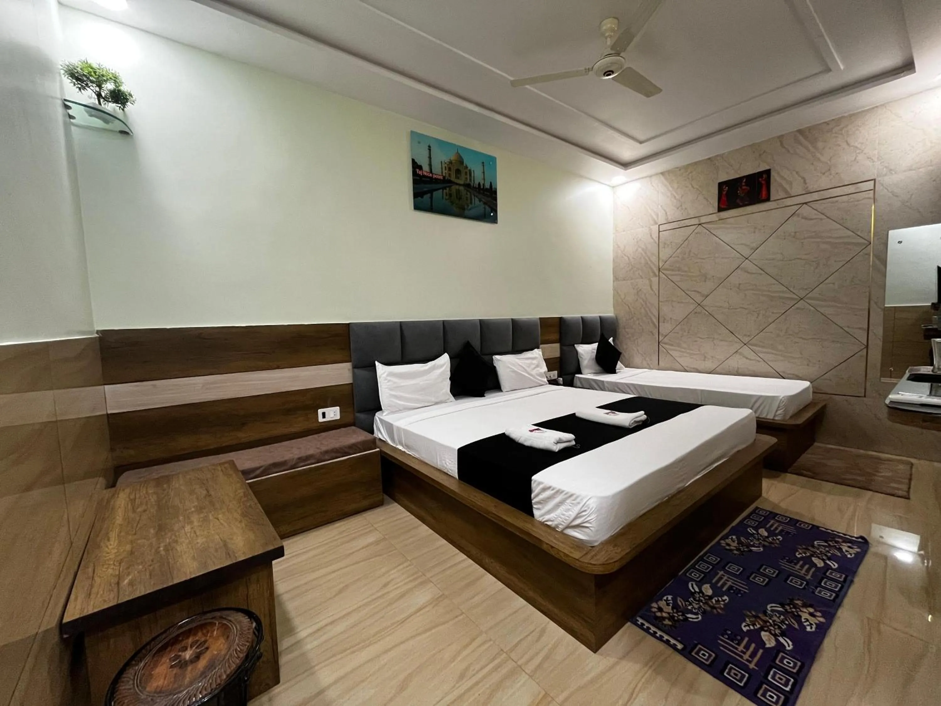 Photo of the whole room, Bed in Taj Nice Point Manage by Taj Sunrise Group