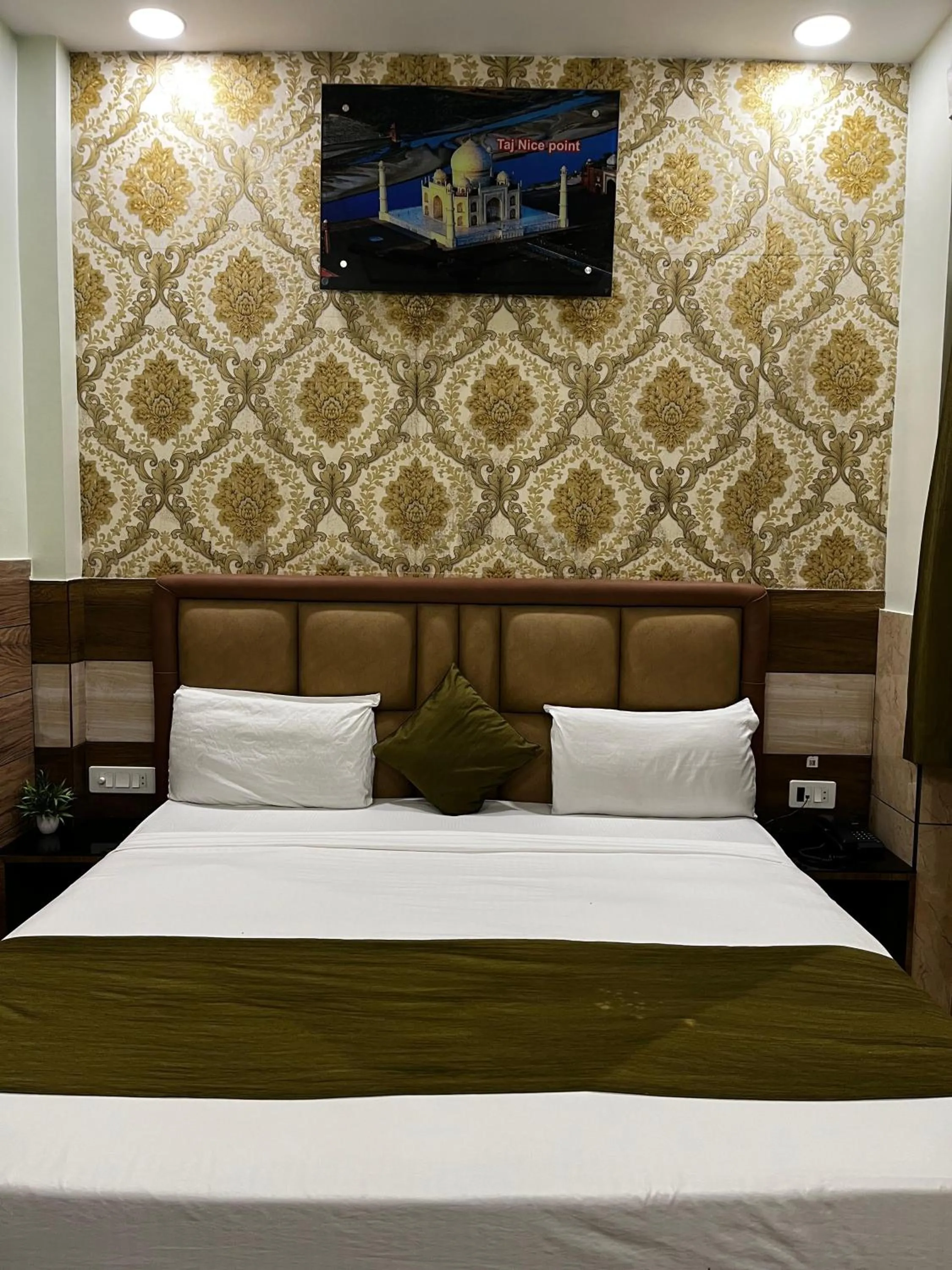 Living room, Bed in Taj Nice Point Manage by Taj Sunrise Group