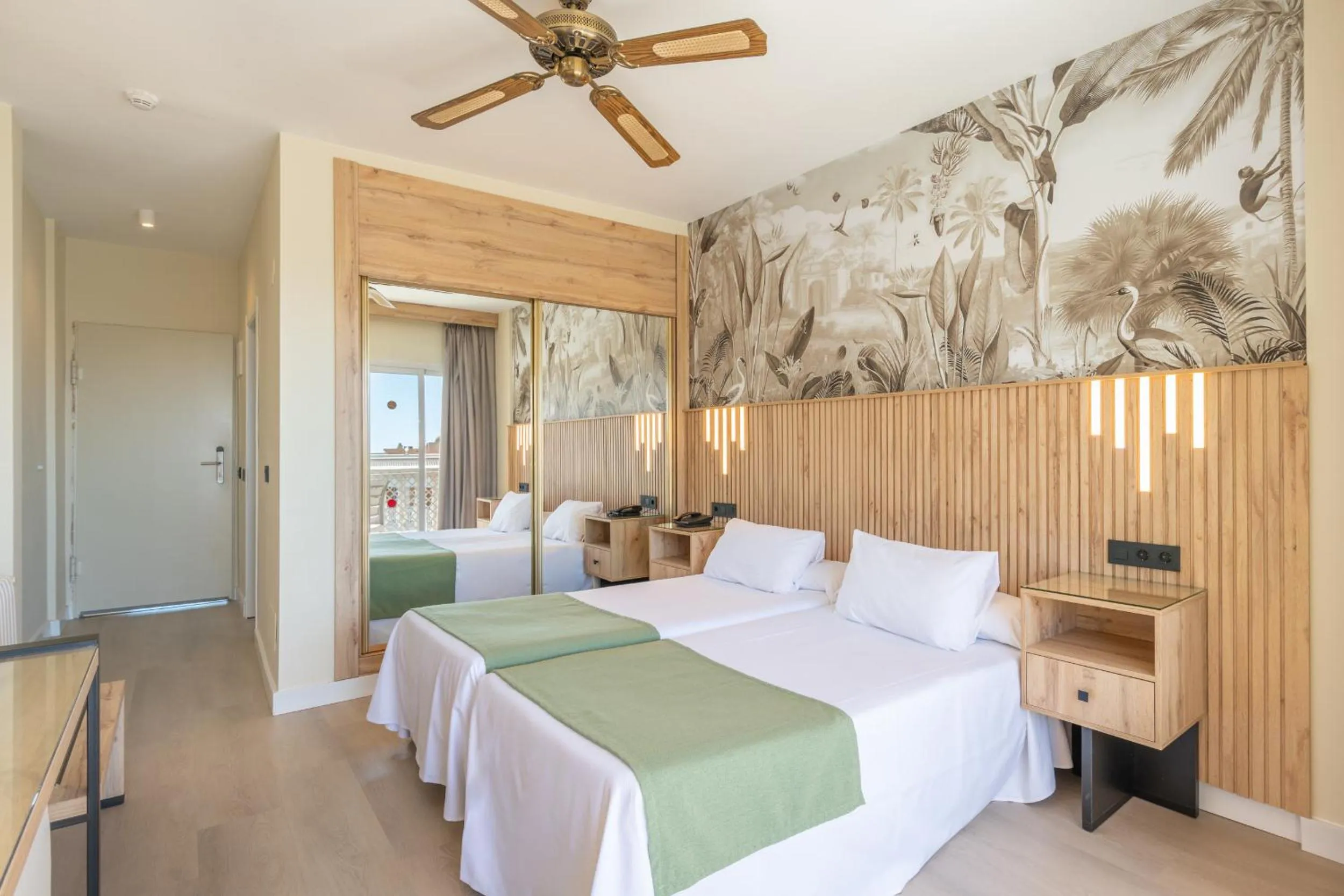 Bed in Hotel Parasol by Dorobe