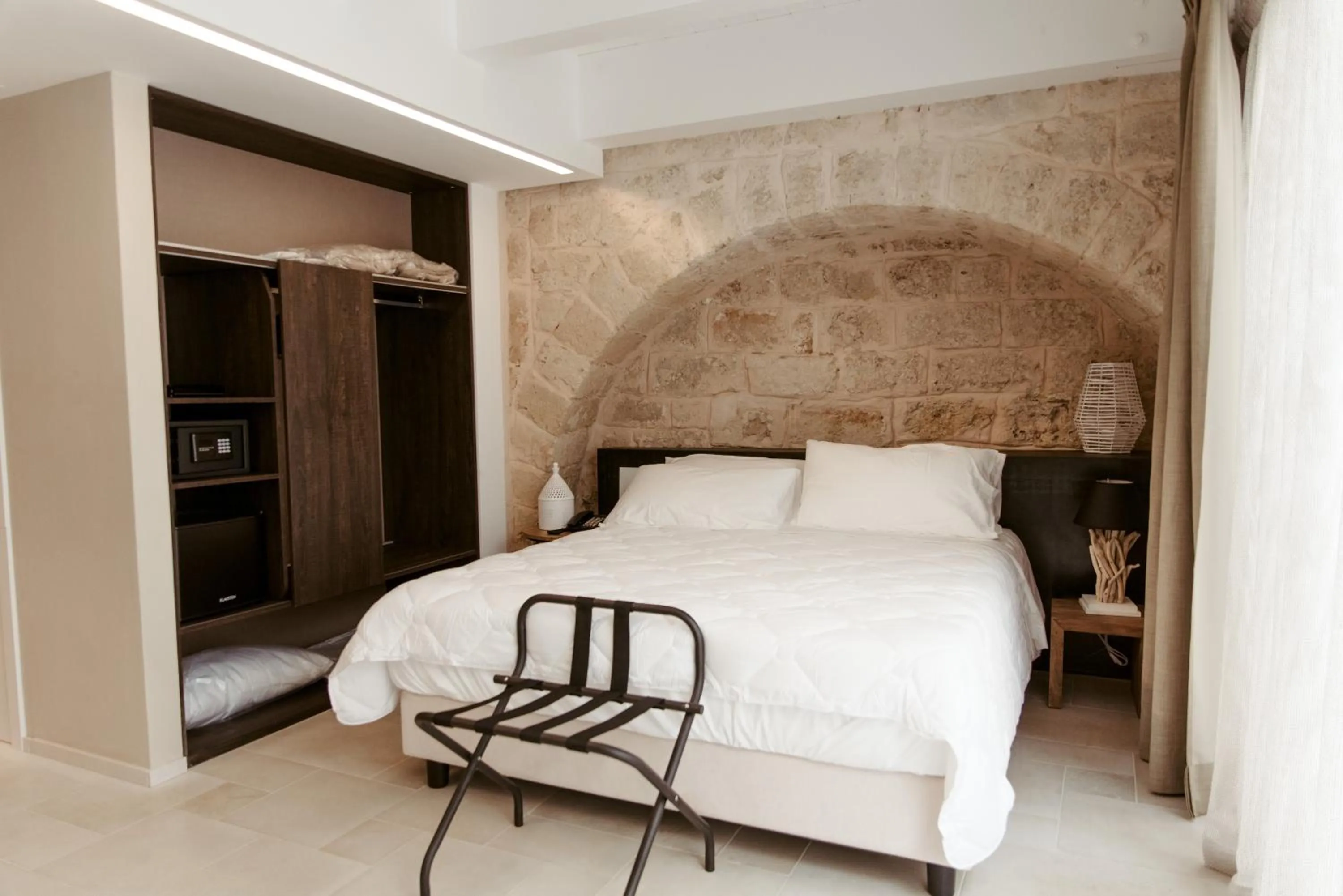 Bed in Le Carasse Boutique Hotel