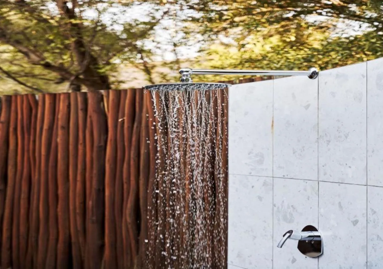 Shower in Letamo at Qwabi Private Game Reserve by NEWMARK