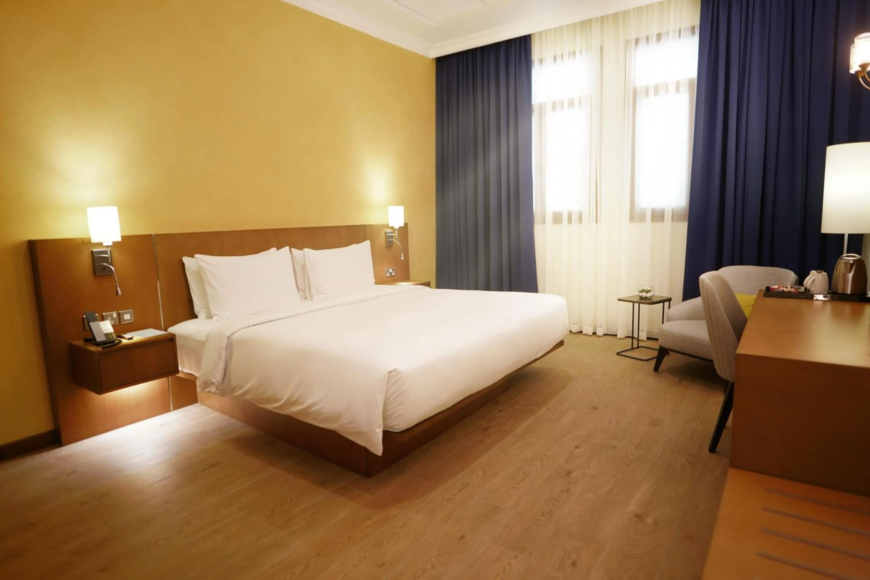 Bed in La Maison Hotel Doha