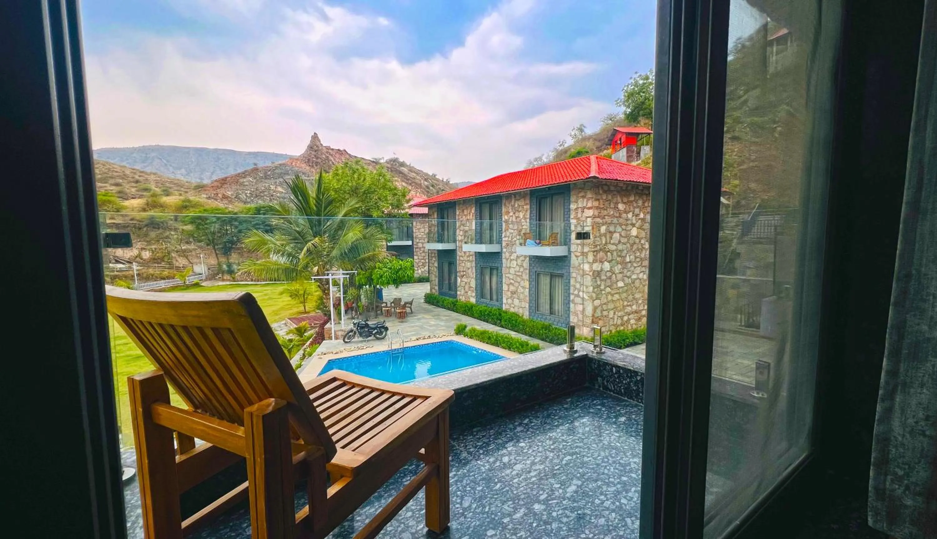 Balcony/Terrace, Pool View in The Divine Hills Resort