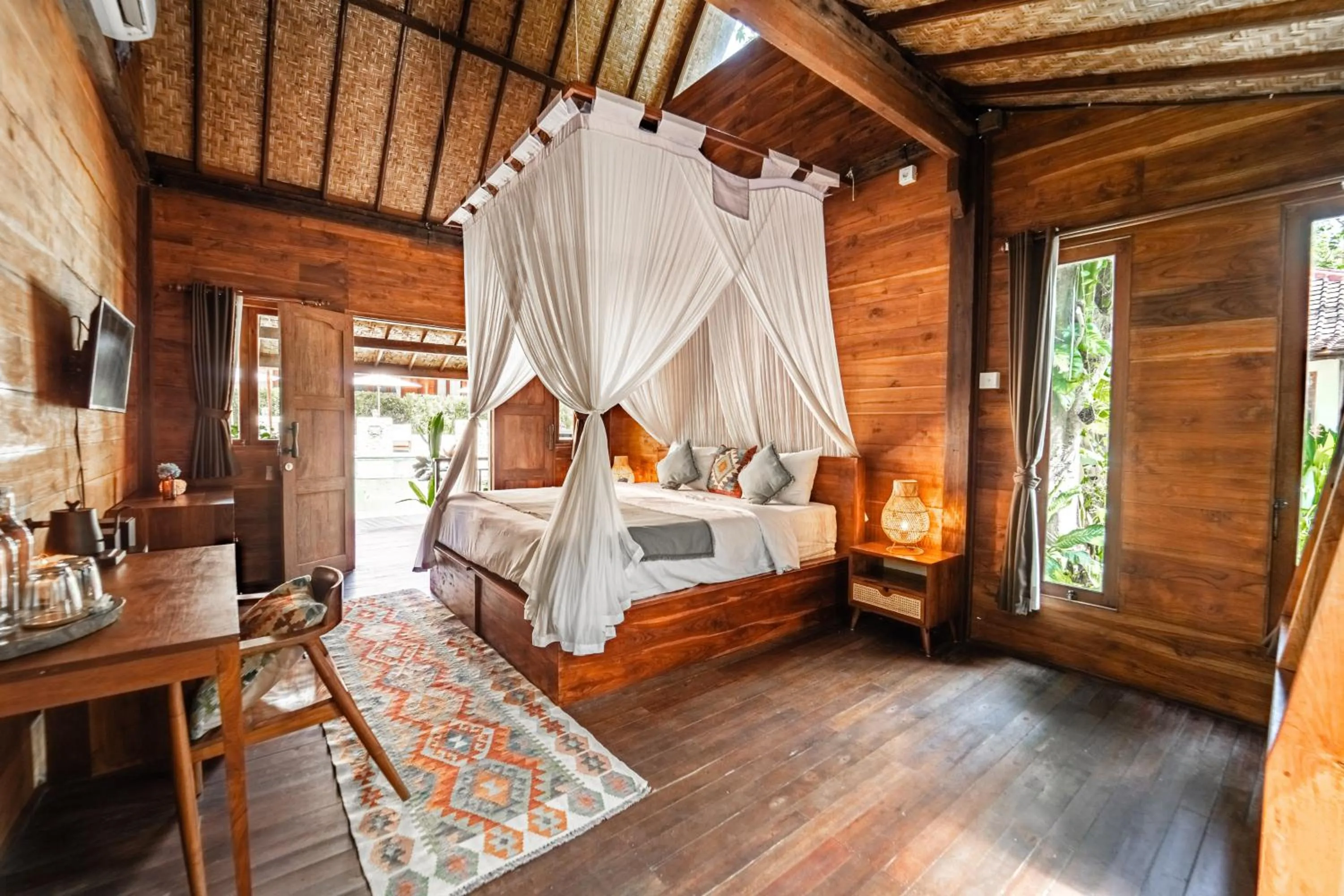 Bed in Kayu Mama Resort and Spa
