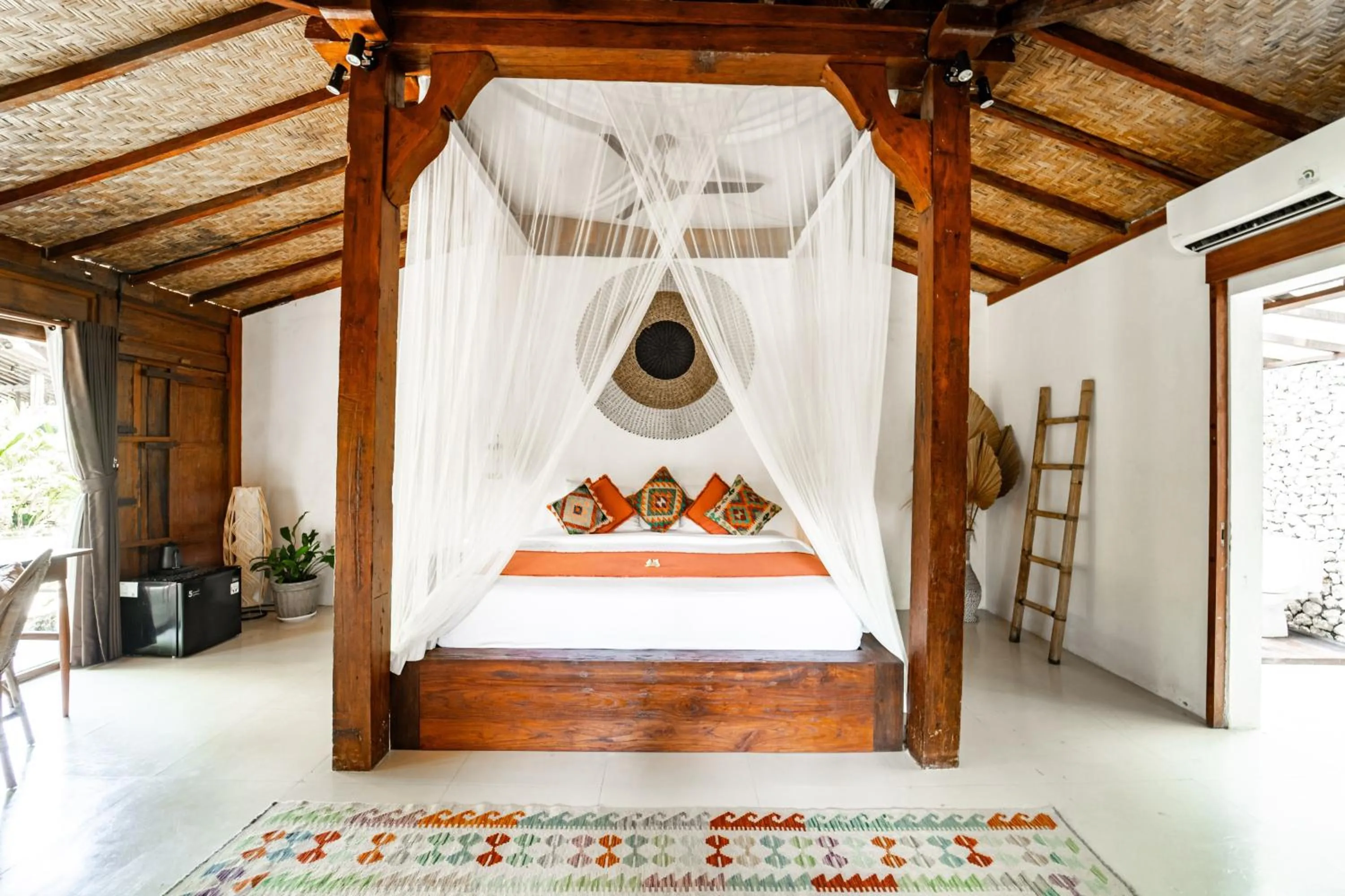 Bed in Kayu Mama Resort and Spa