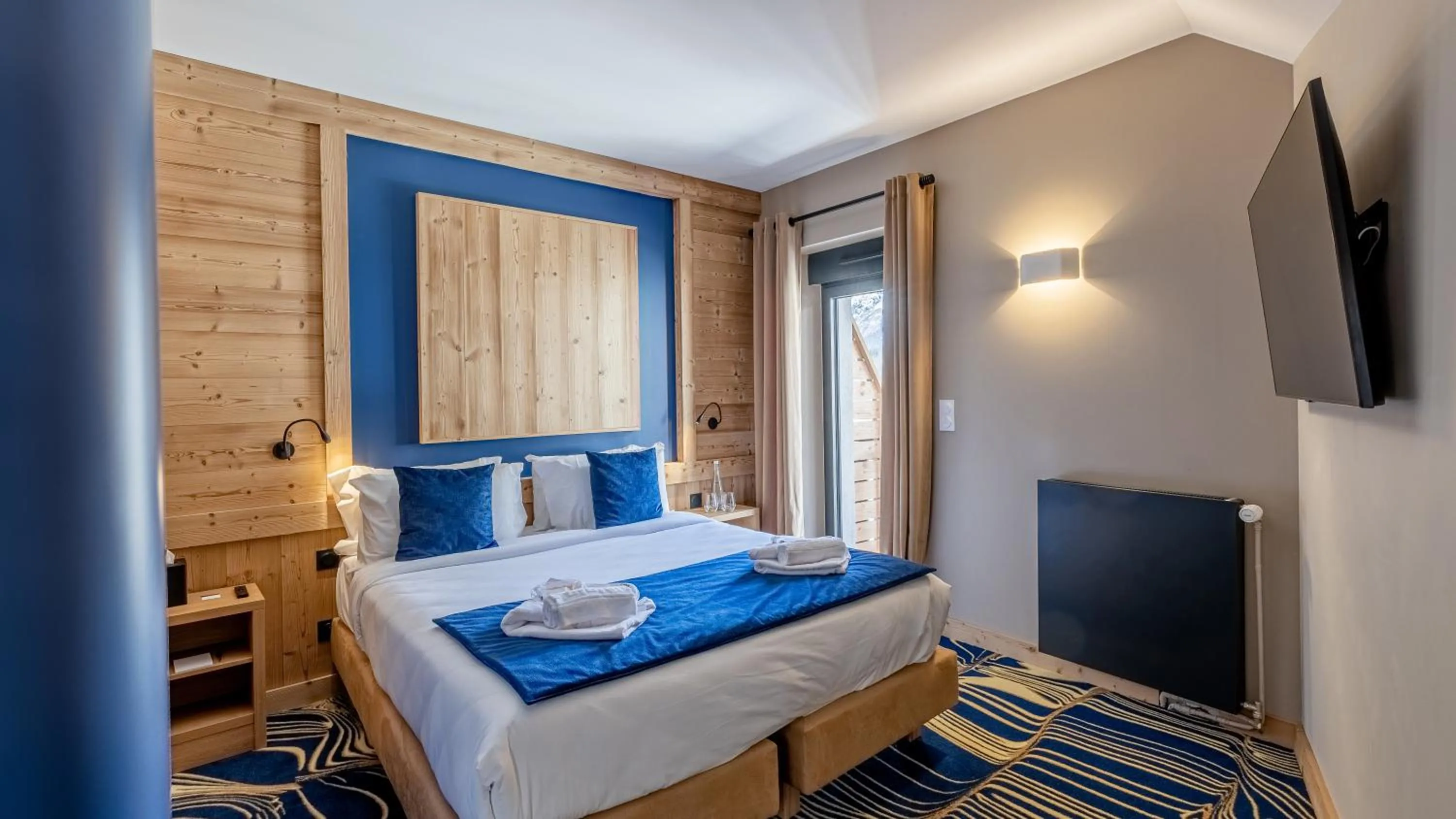 Bed in Madame Vacances Hotel Les Cimes