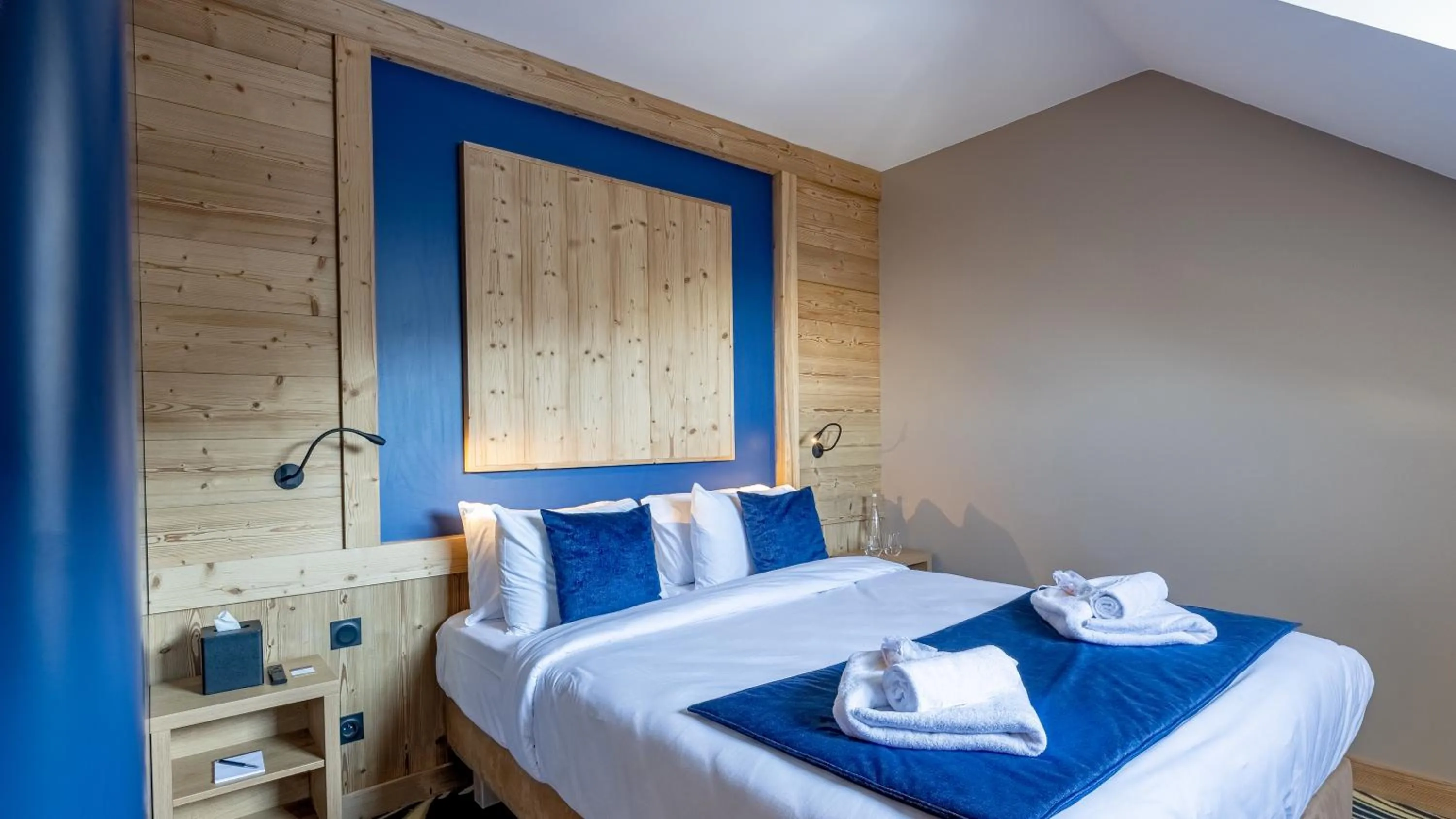 Bed in Madame Vacances Hotel Les Cimes