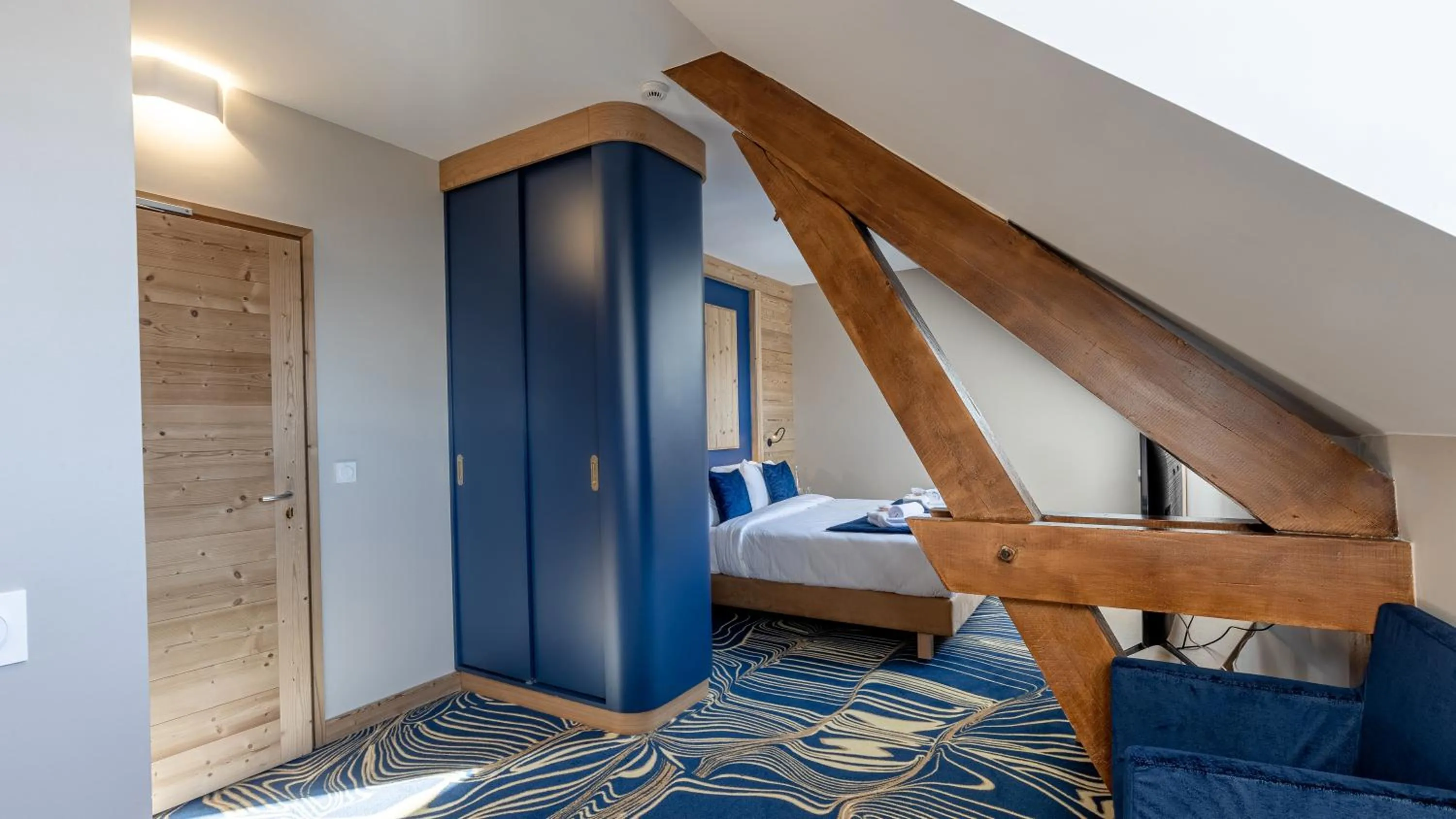 Bed in Madame Vacances Hotel Les Cimes