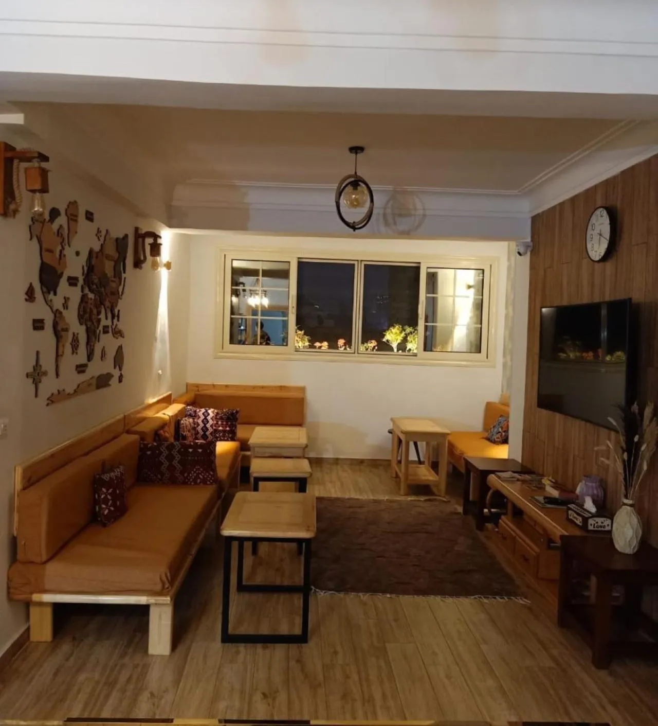 Communal lounge/ TV room in Champollion Hostel