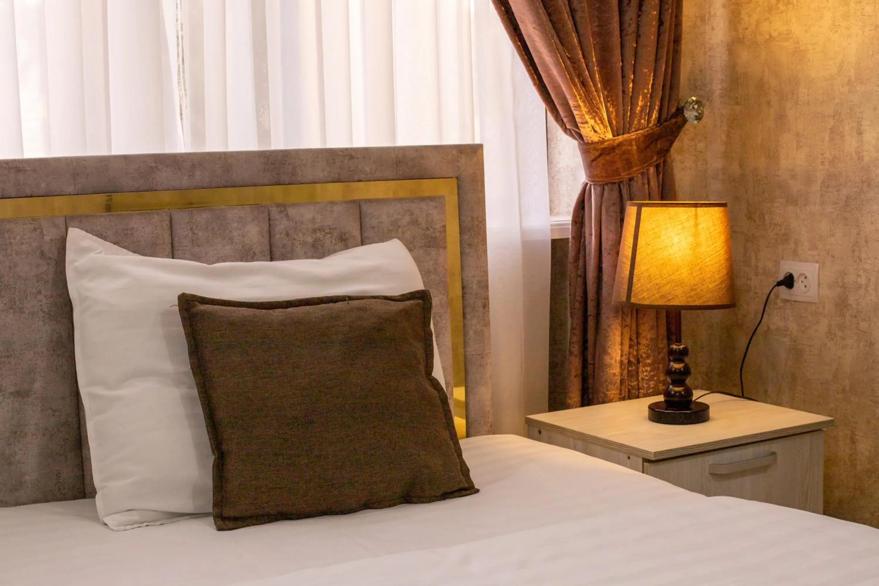 Bed in Osiyo Plaza Hotel