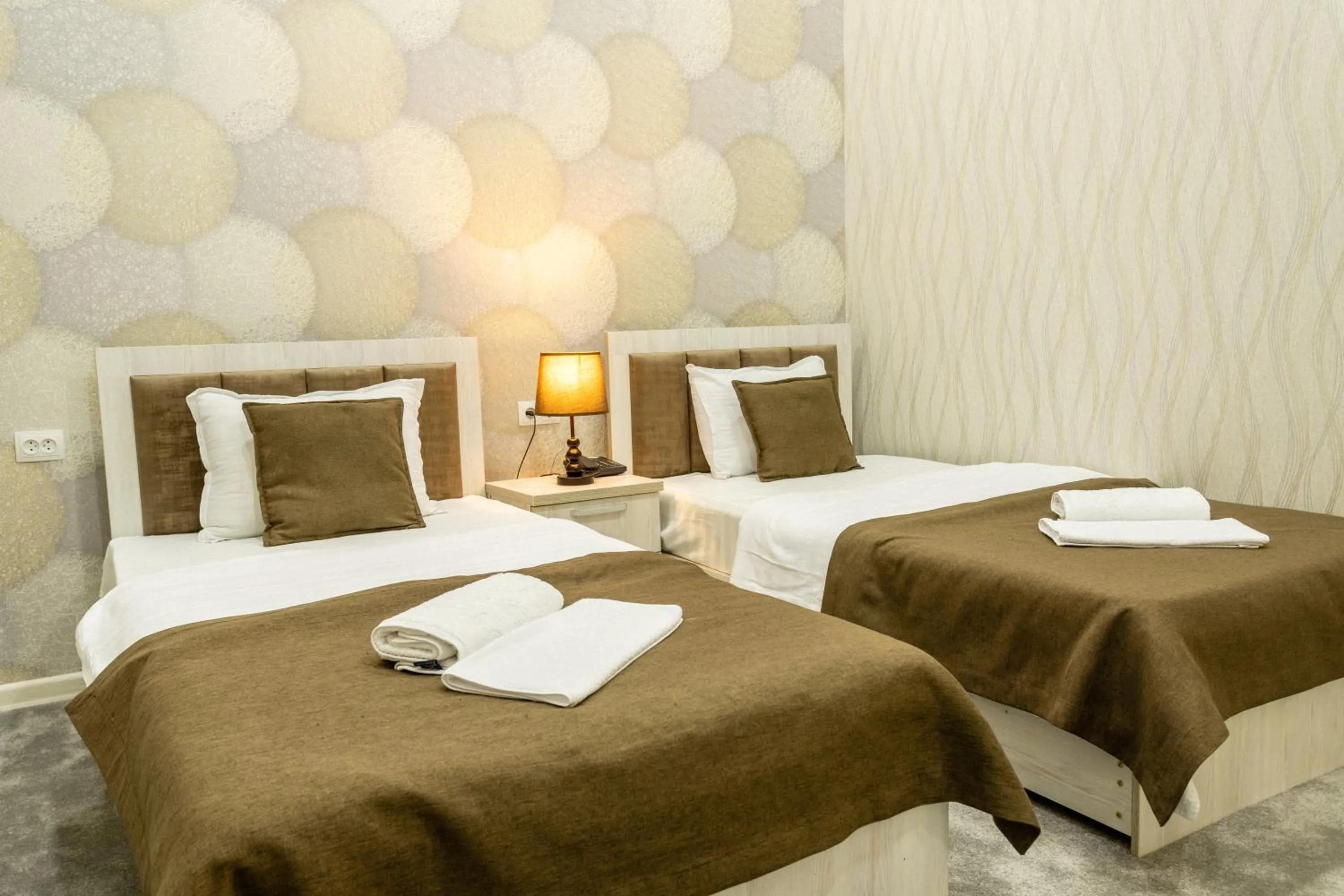 Bed in Osiyo Plaza Hotel