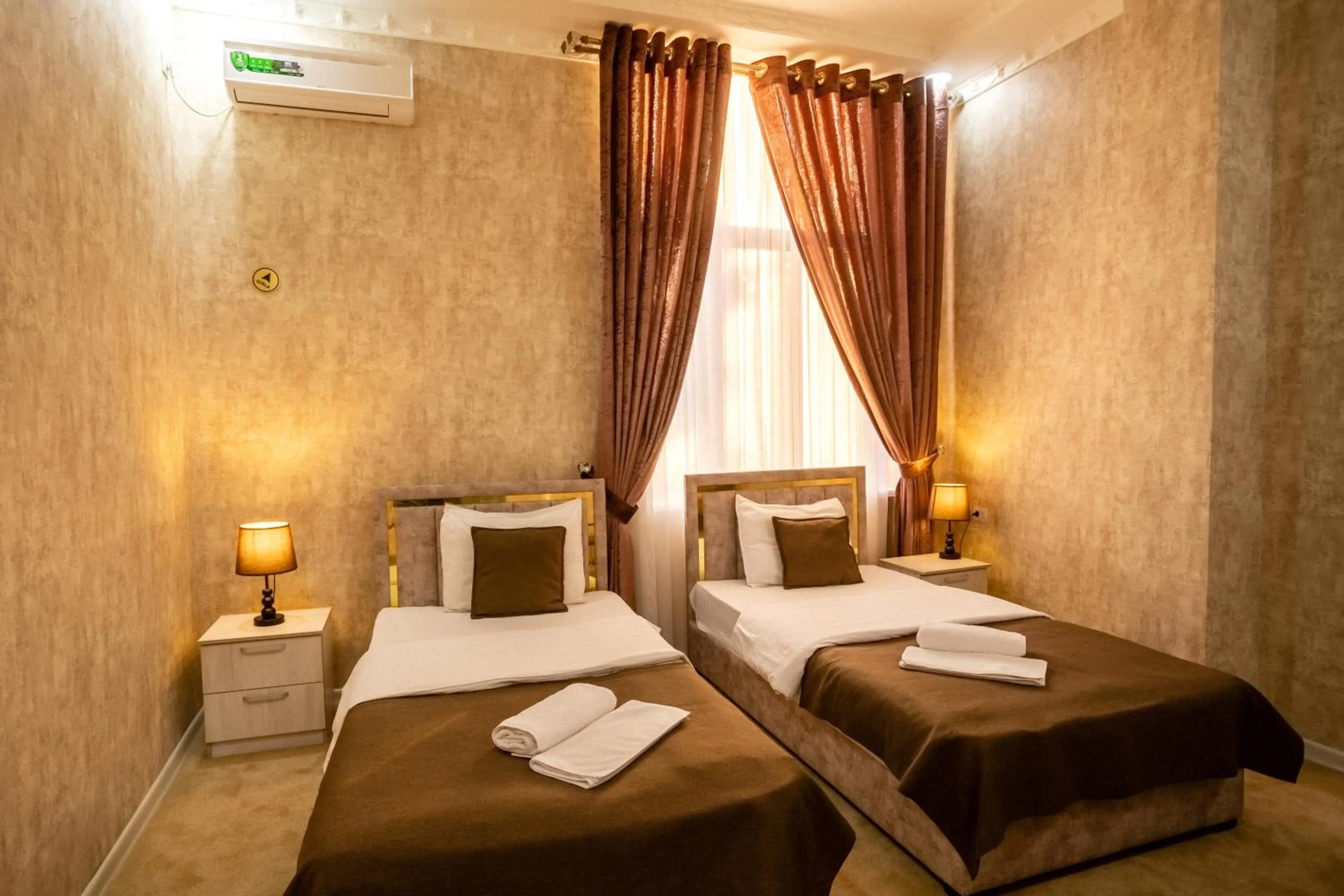 Bed in Osiyo Plaza Hotel