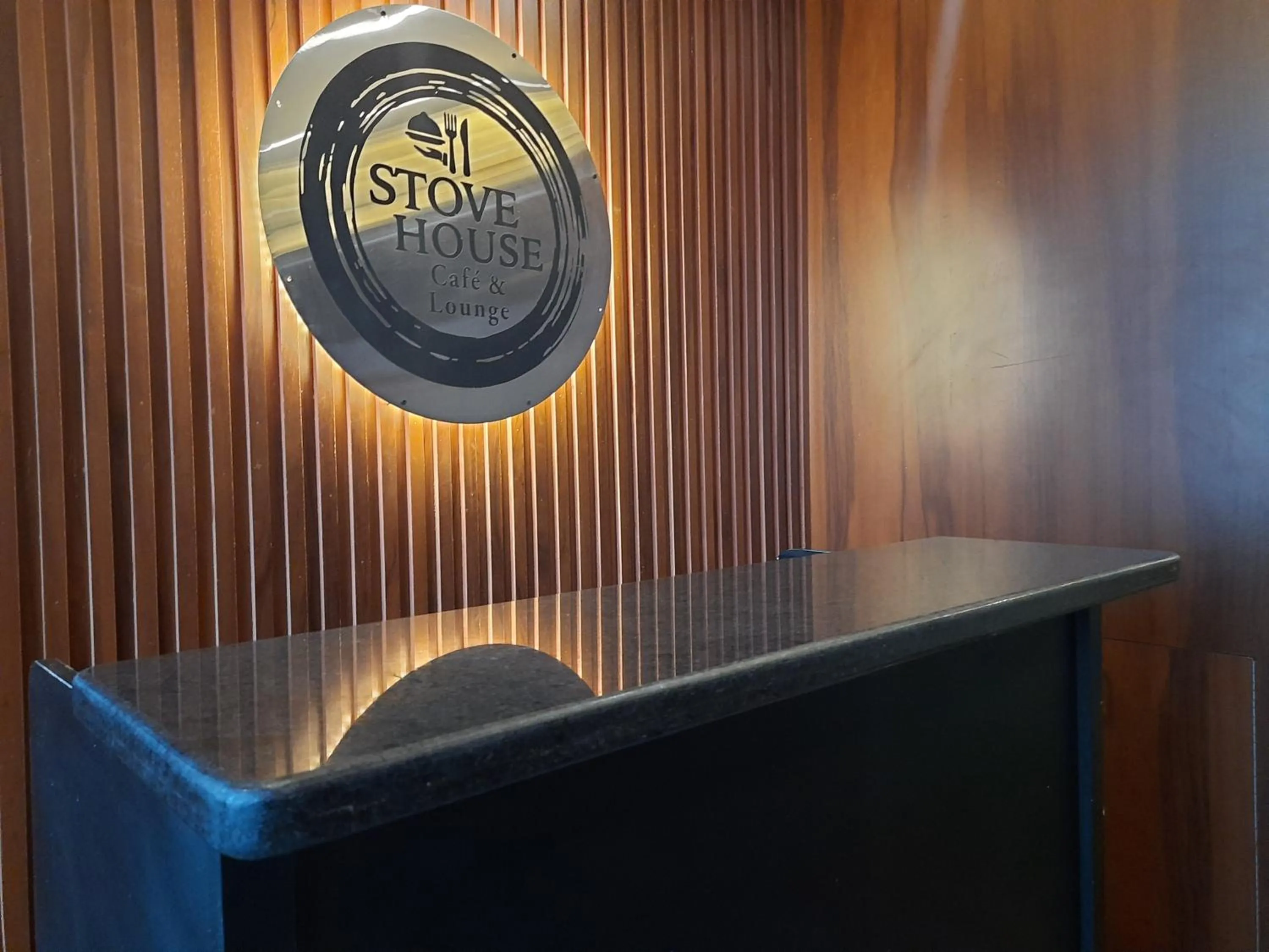 Property logo or sign in Stovehouse Inn