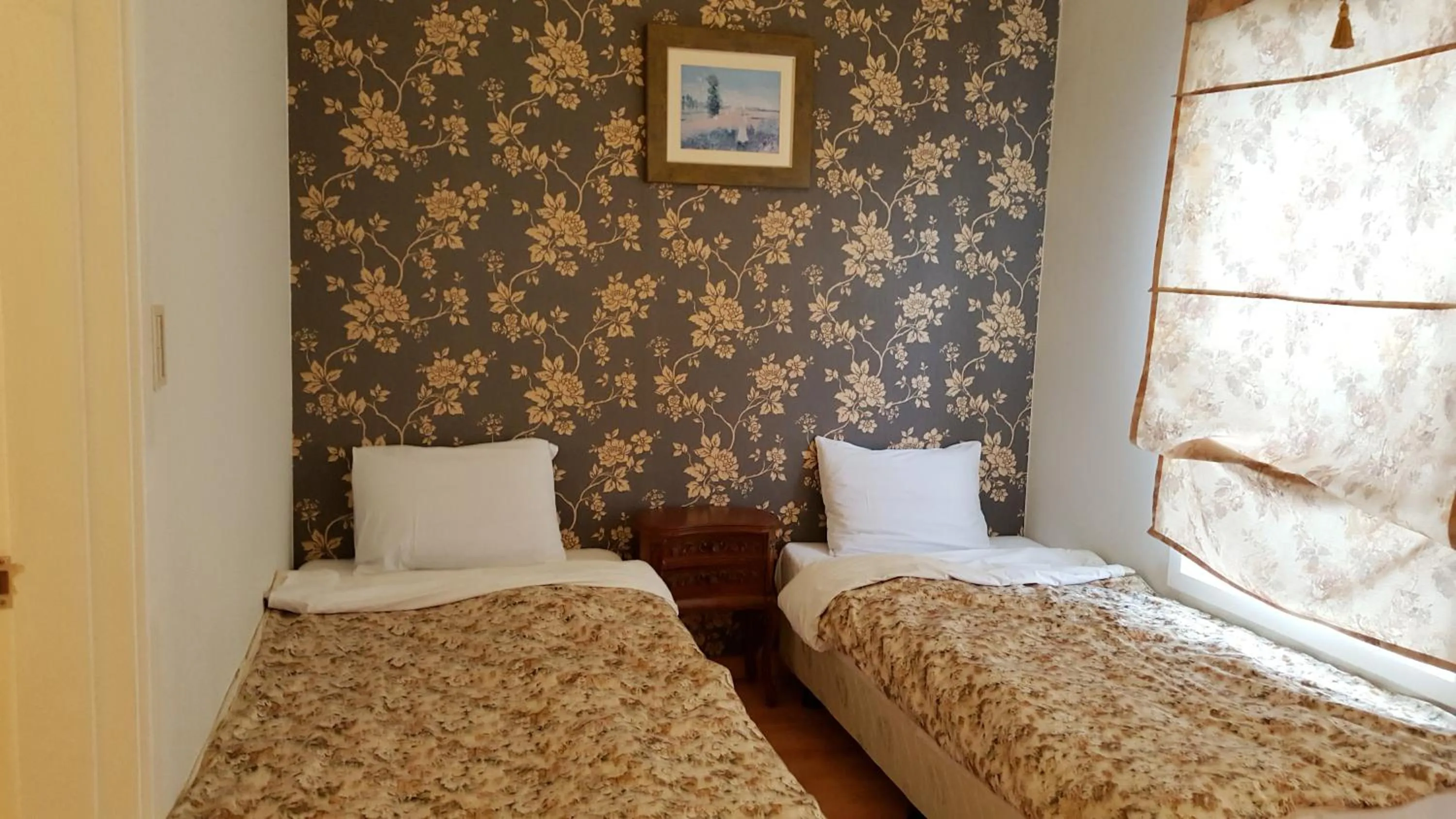 Bed in Elf Resort Hotel