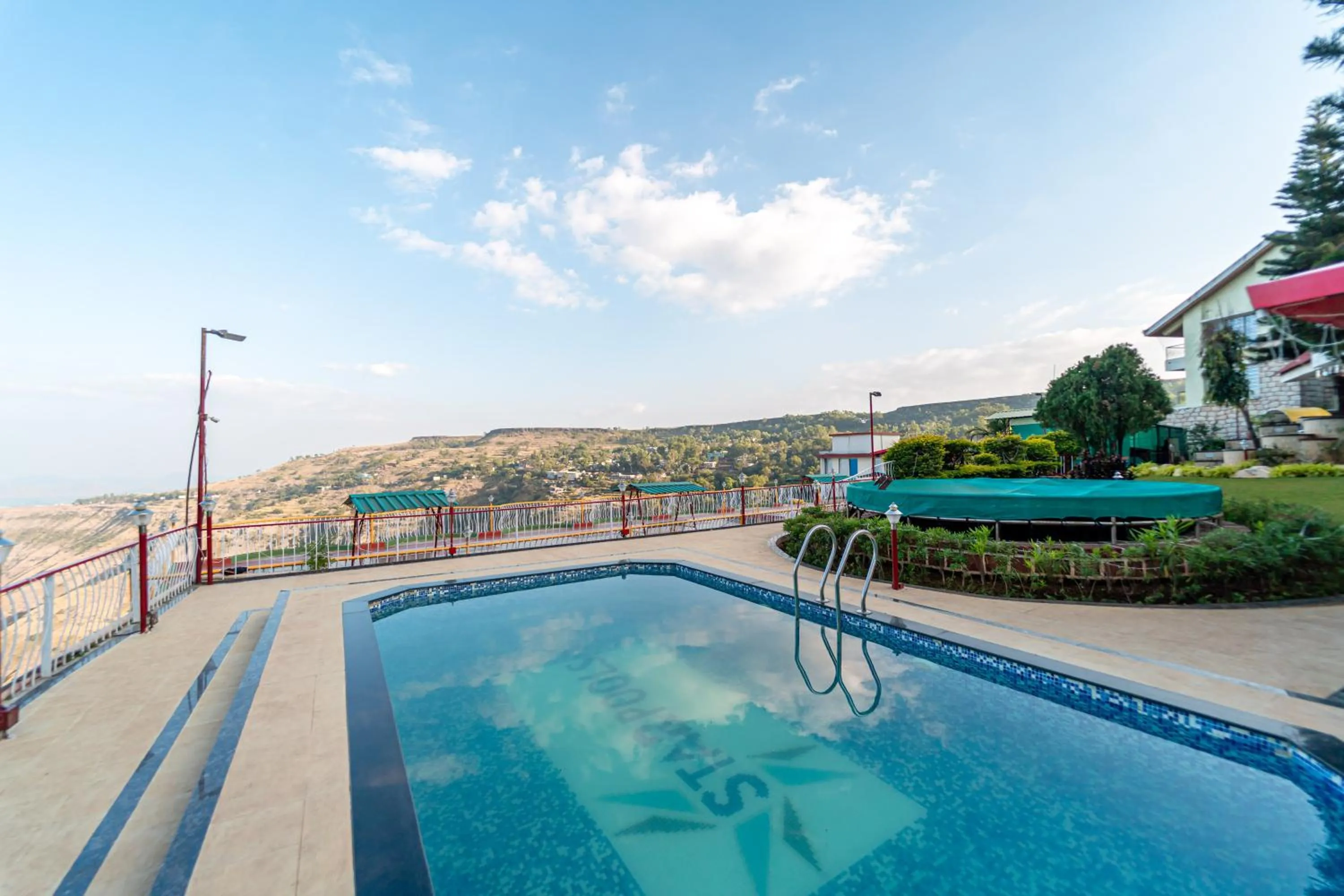 Swimming pool in Treebo Raval Resort with Valley View