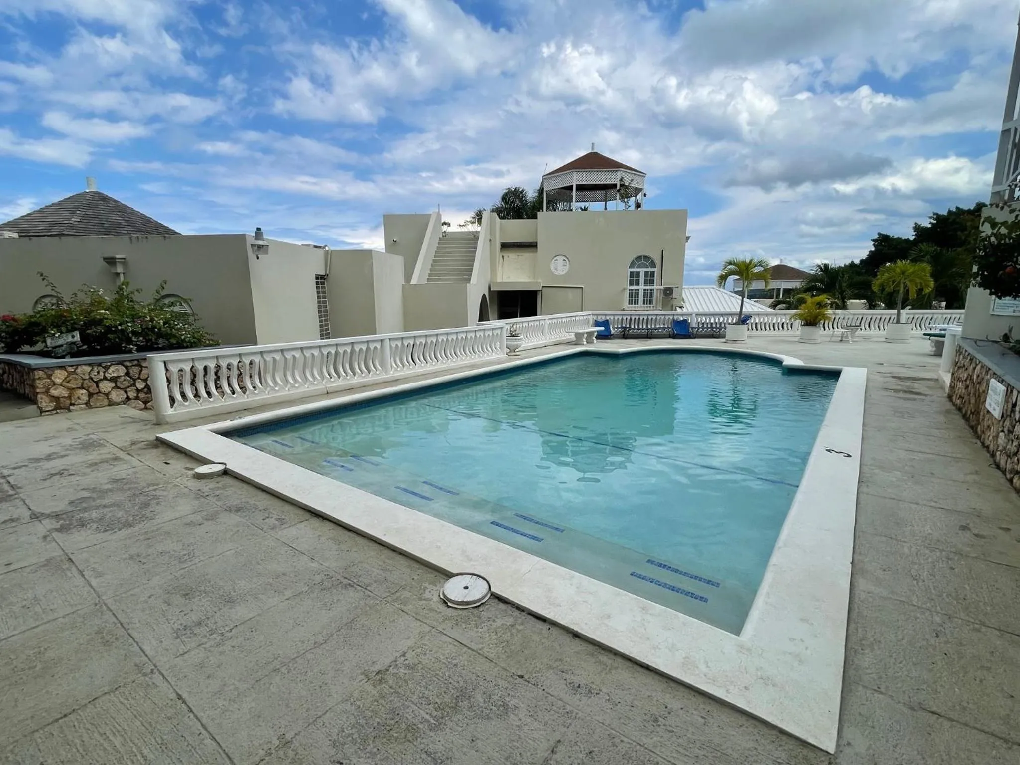 Swimming pool in Hummingbird Retreat - Luxury Oceanview Apt, 7-Minute Walk to Beach