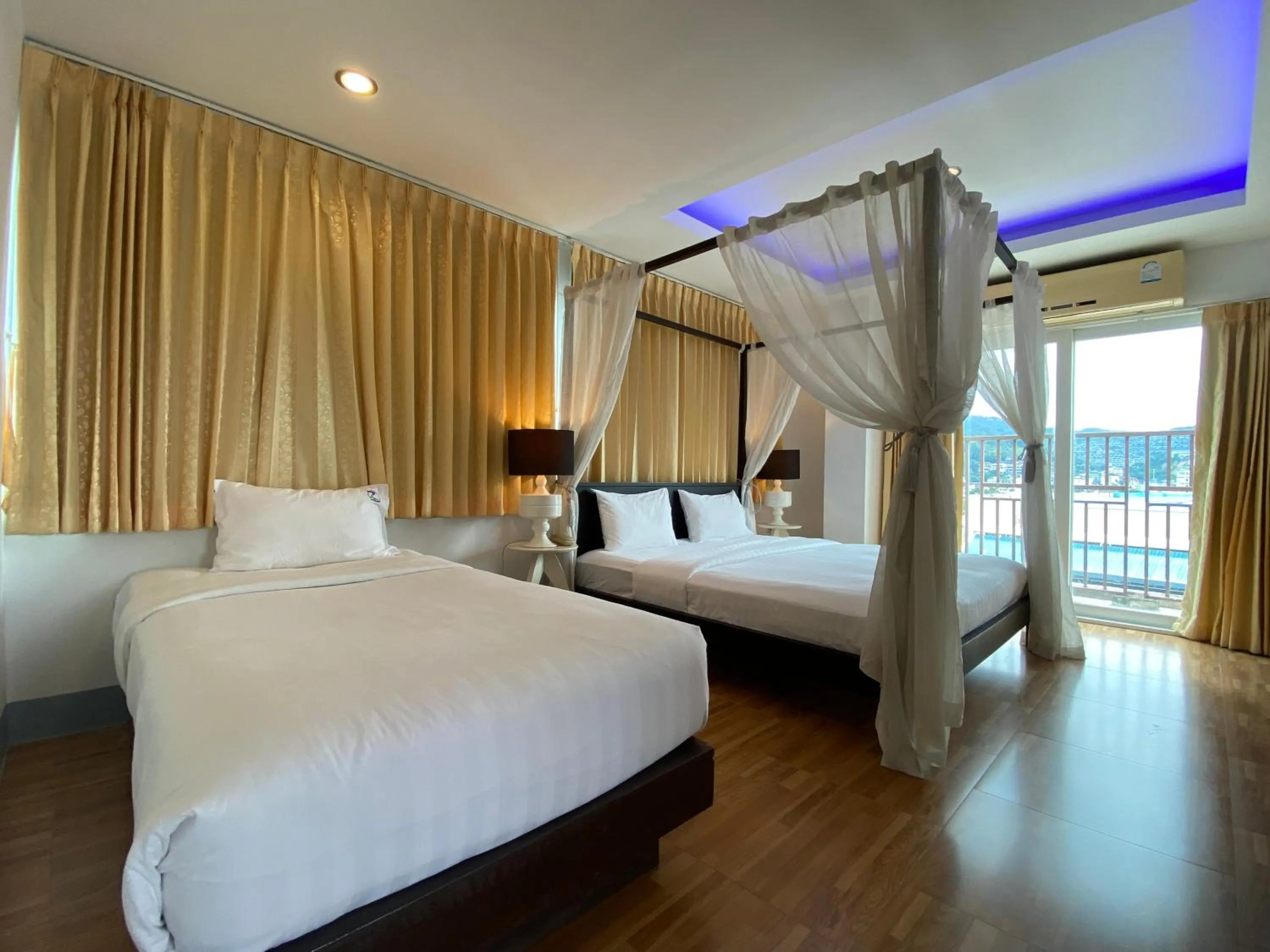 Bed in 77 Patong Hotel & Spa
