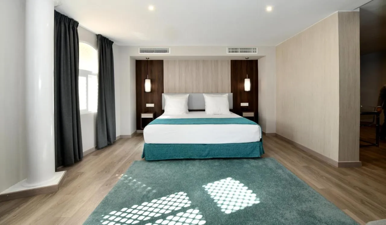 Bed in Hotel Salobreña Suites