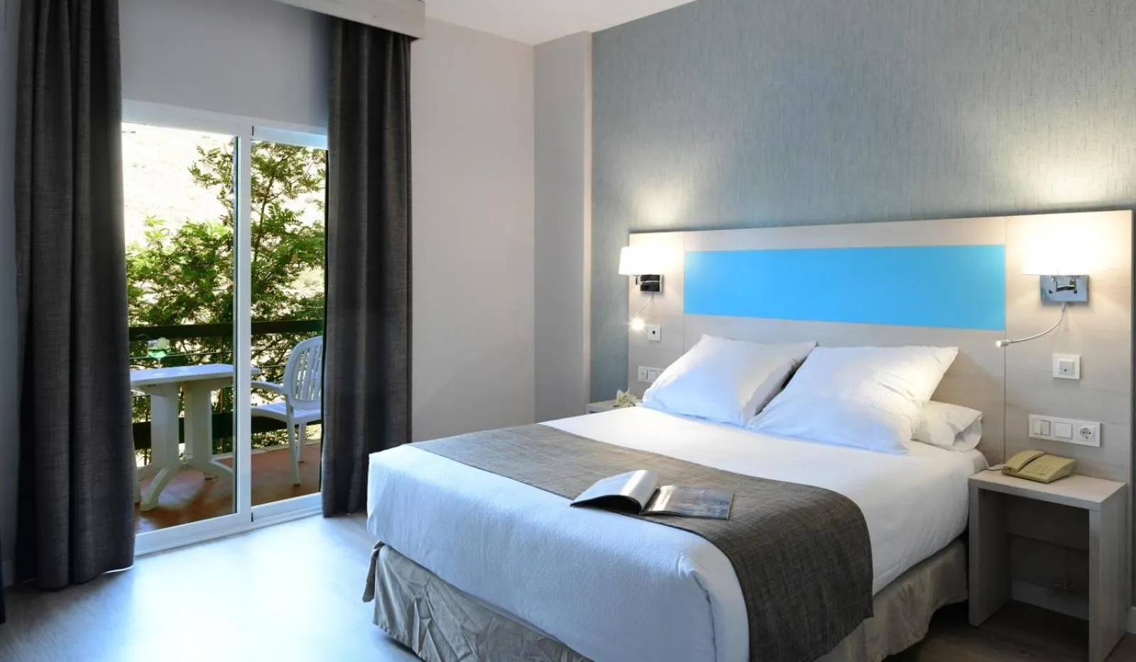 Bed in Hotel Salobreña Suites