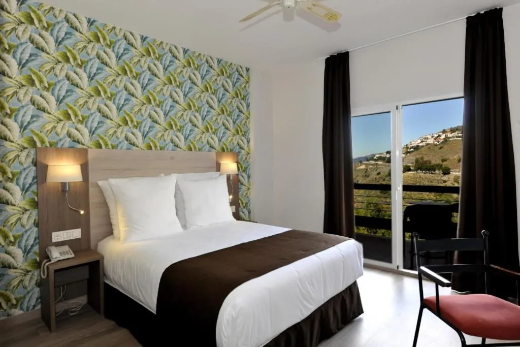 Bed in Hotel Salobreña Suites