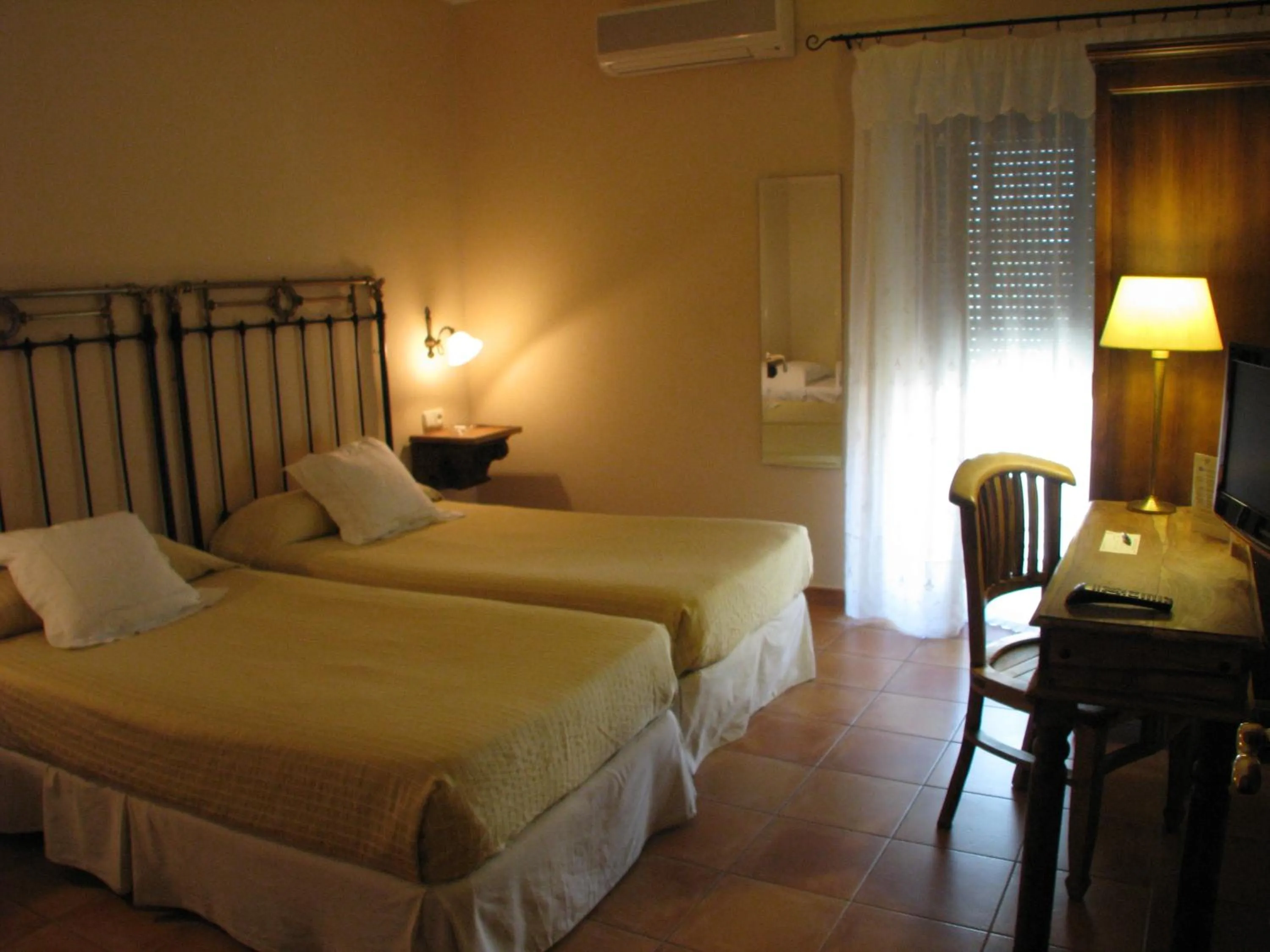 Photo of the whole room, Bed in Hotel Don Carlos Cáceres