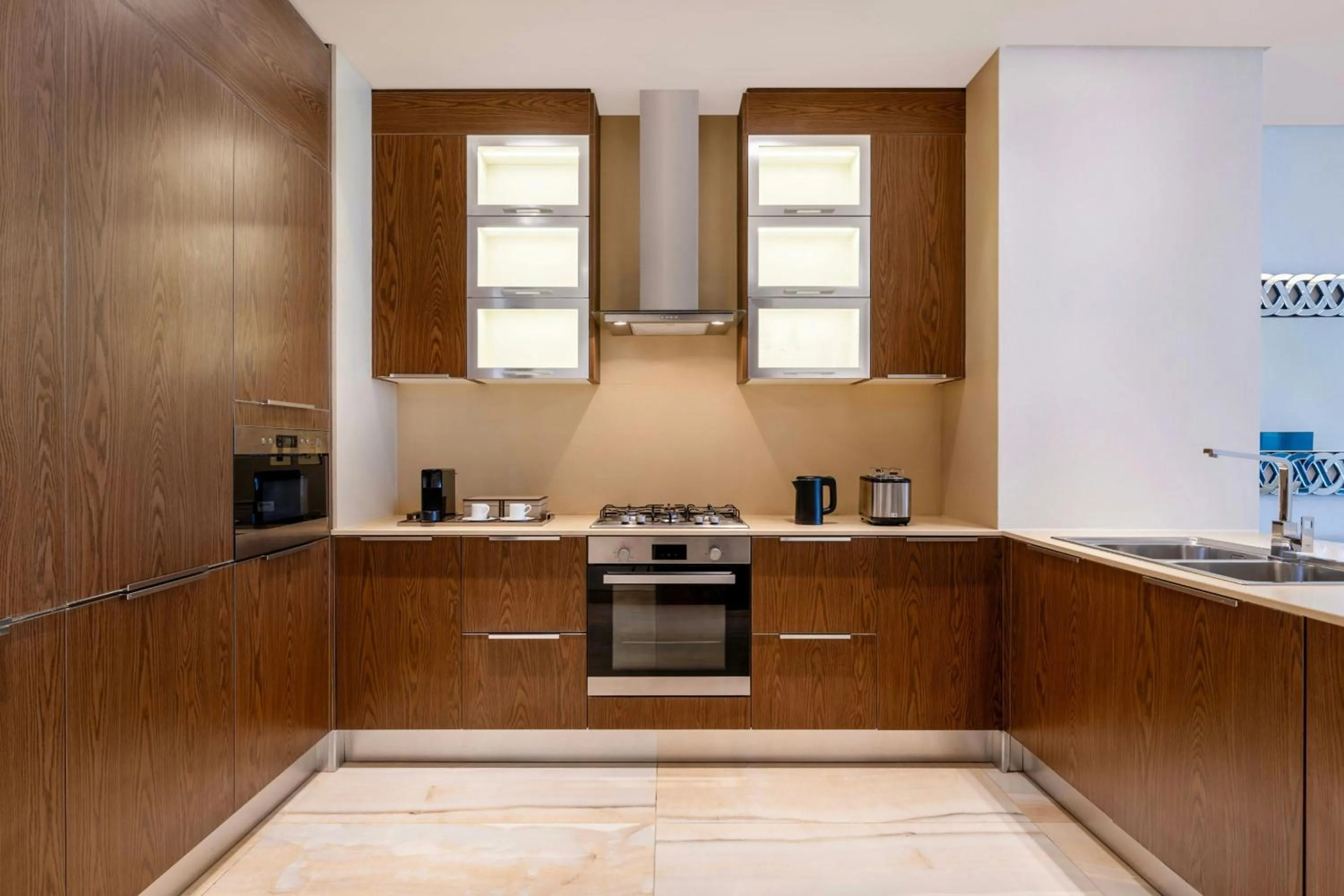 Kitchen or kitchenette in Agora, Doha, Autograph Collection