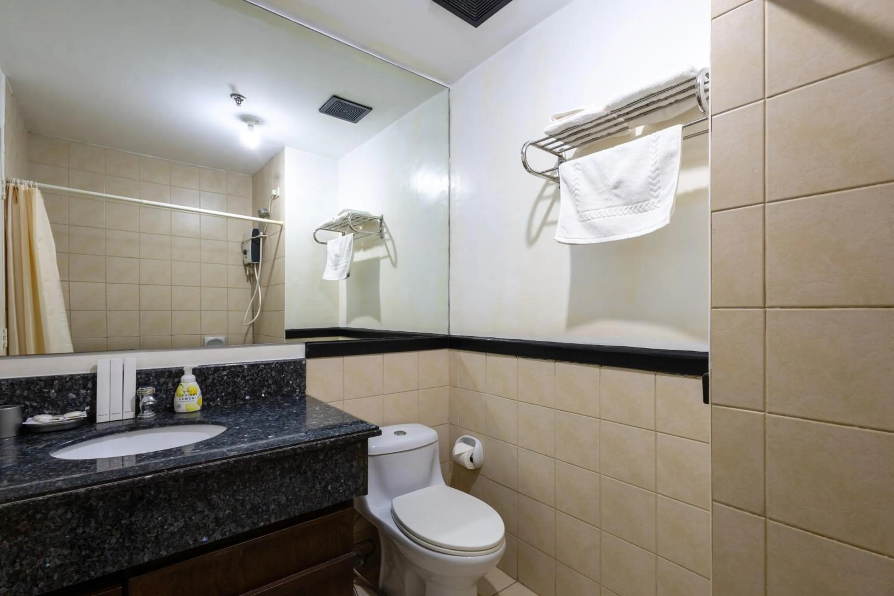 Shower in Spacious Penthouse Near NAIA with 24-7 Convenience