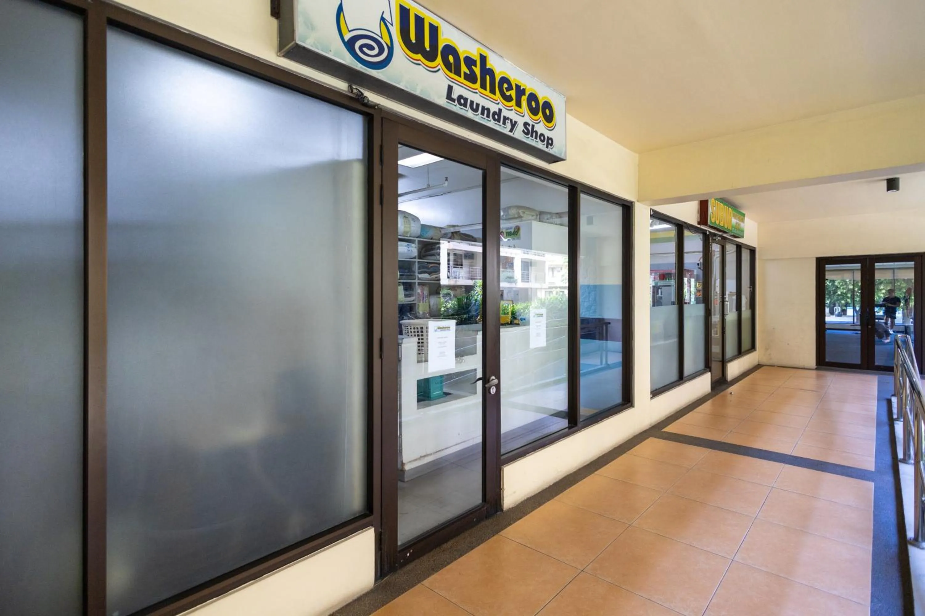 laundry in Spacious Penthouse Near NAIA with 24-7 Convenience