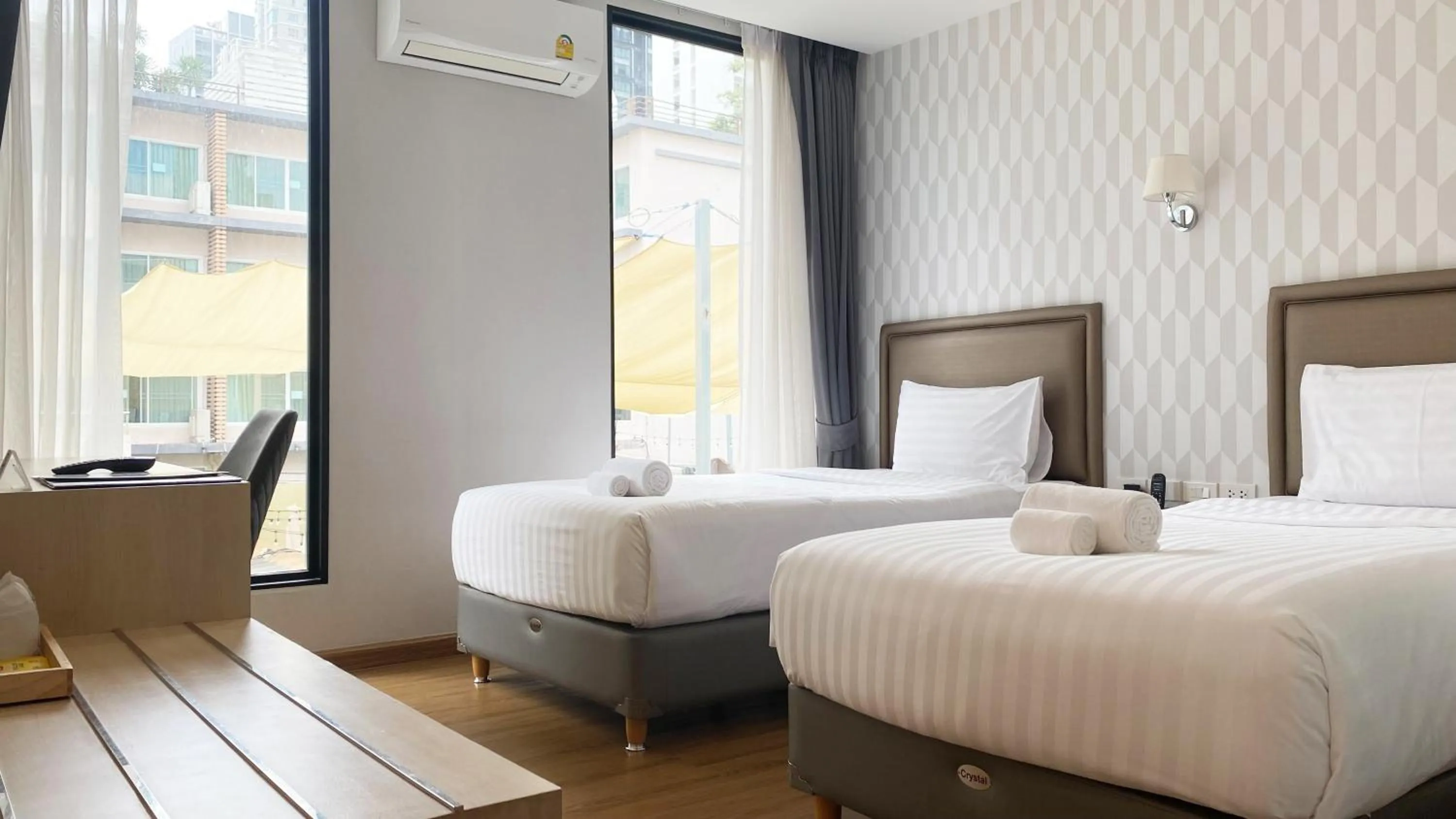 Bed in Lucky Hotel Bangkok