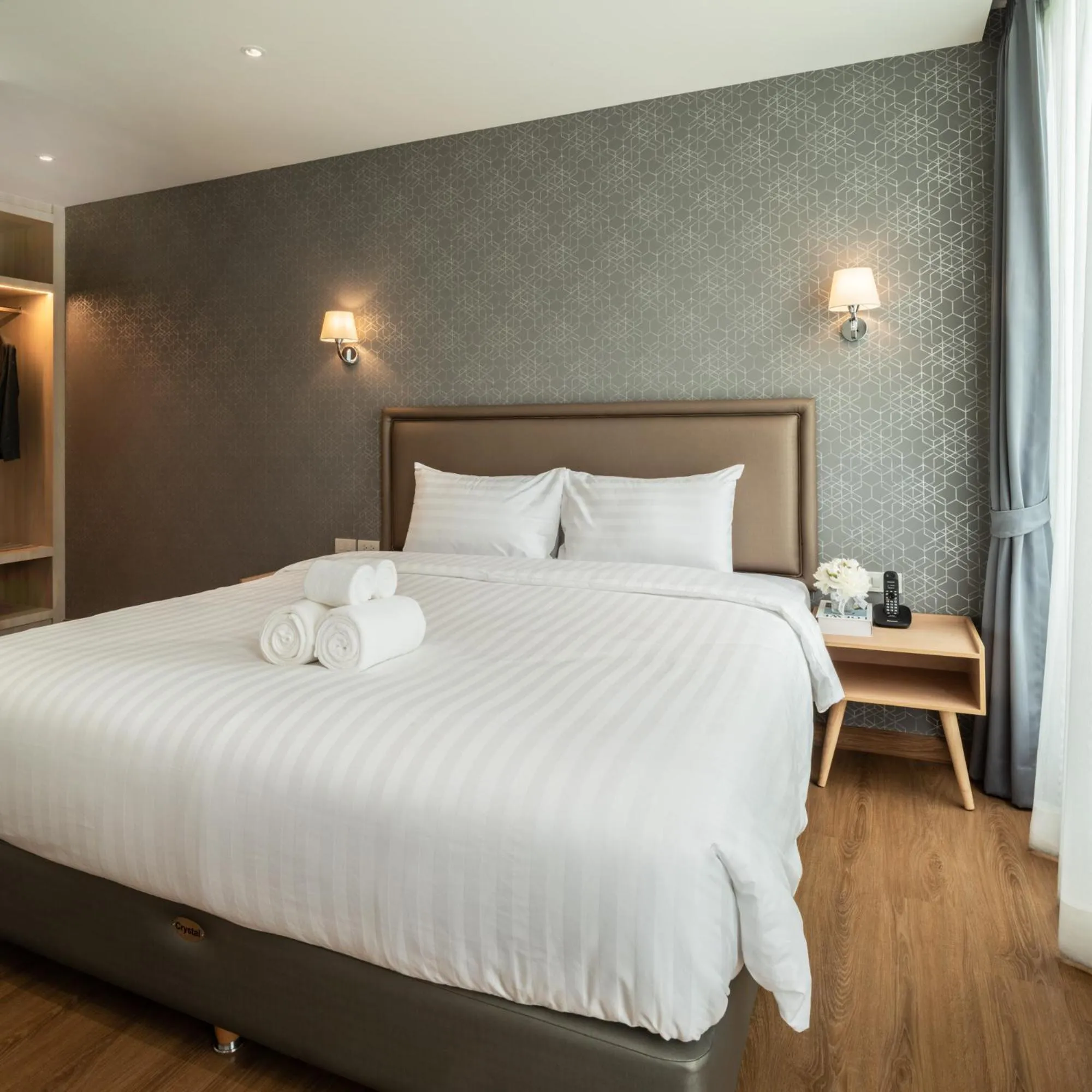 Bed in Lucky Hotel Bangkok