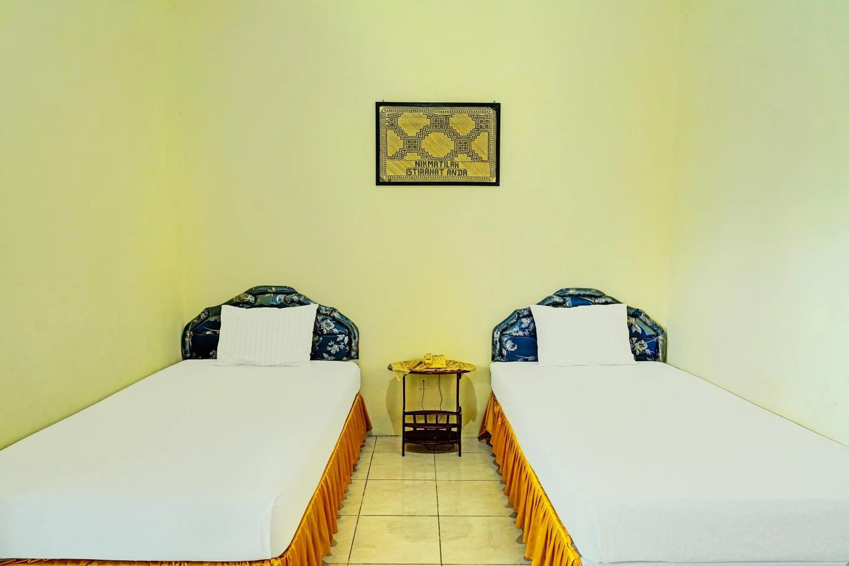 Bedroom in Capital O 91806 Hotel Batu Suli