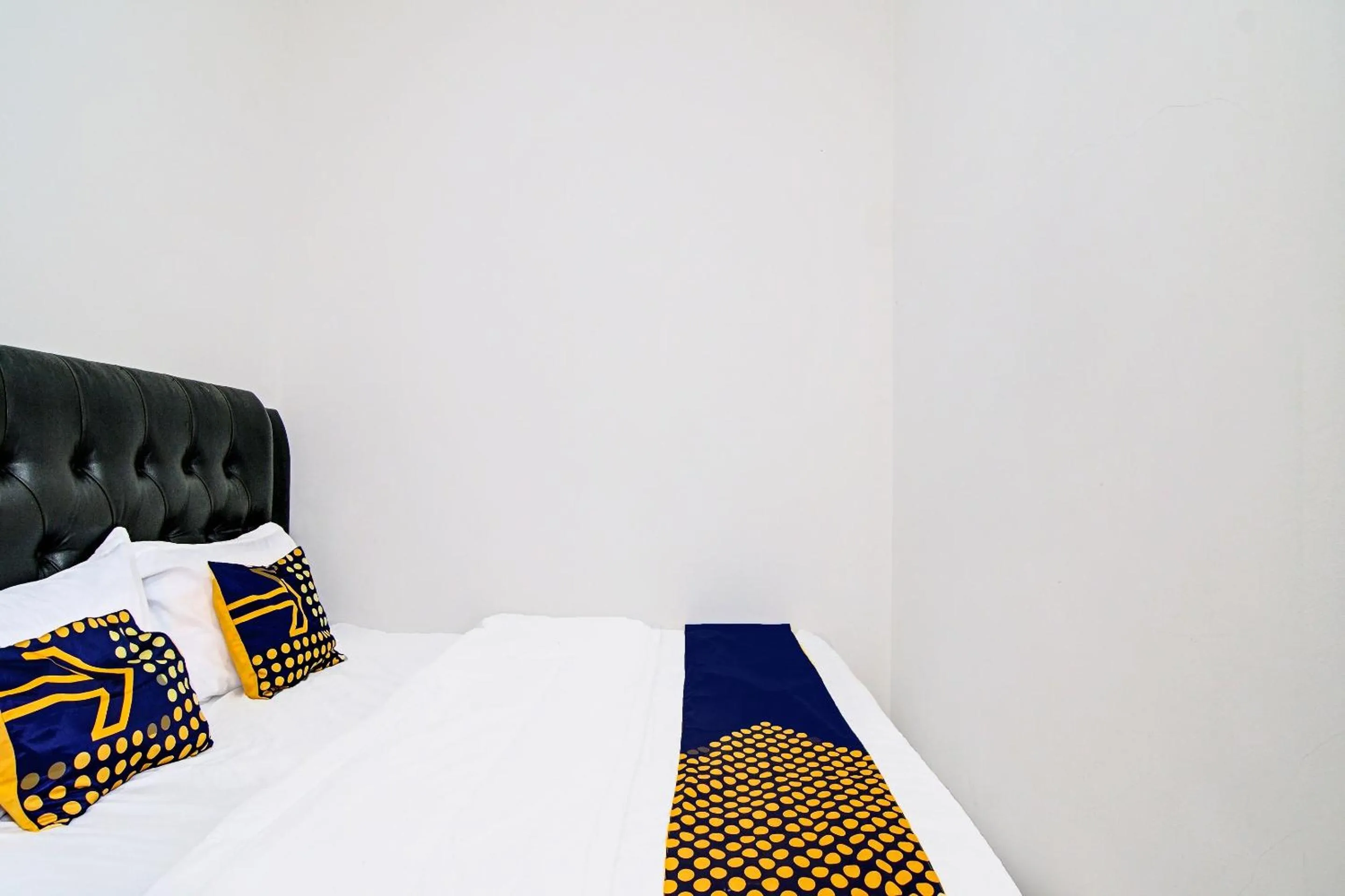 Bedroom in Hotel O Homestay Dinda Syariah Near Masjid Al Amin