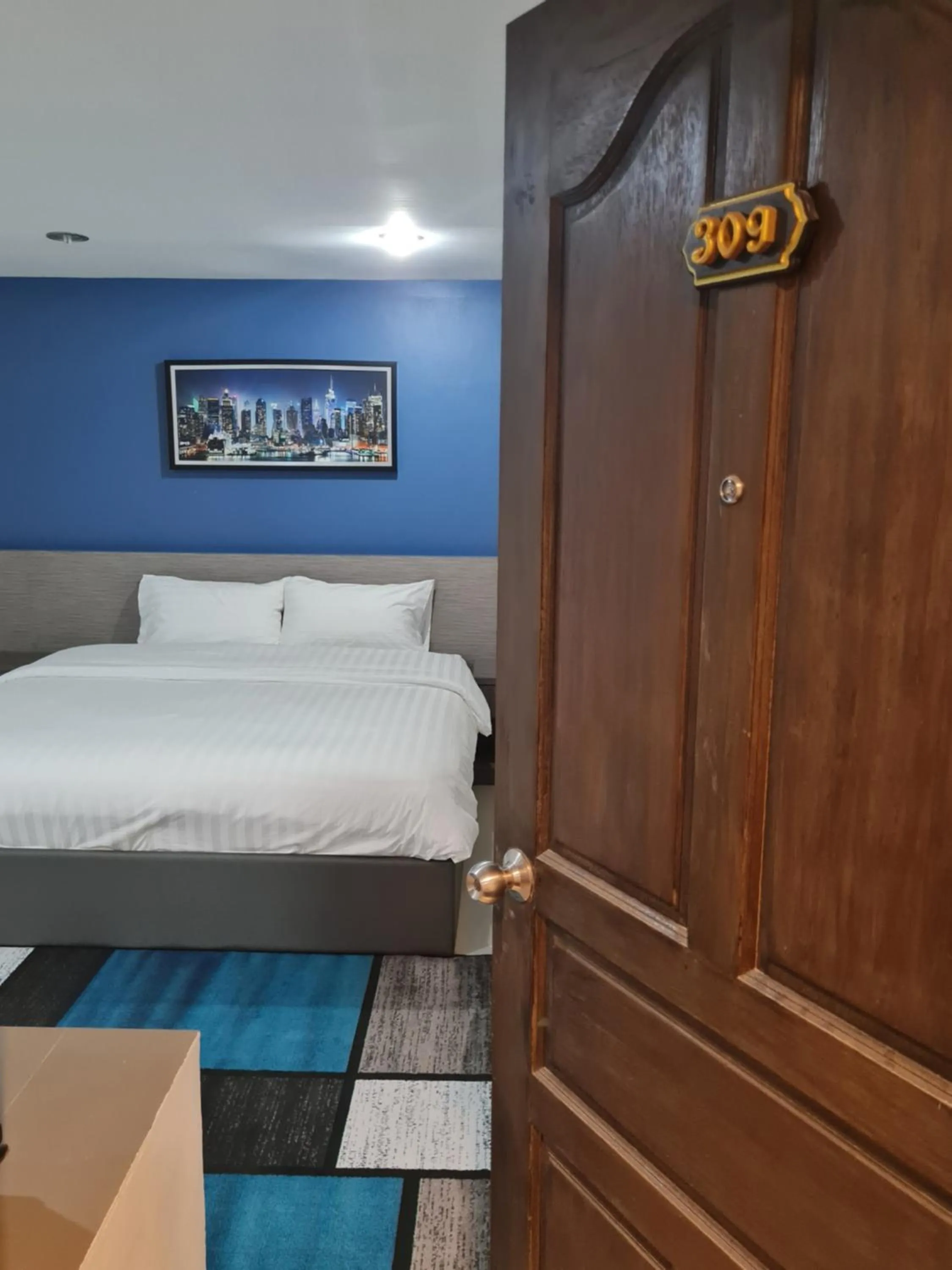 Bed in Poonsuk Place Hotel